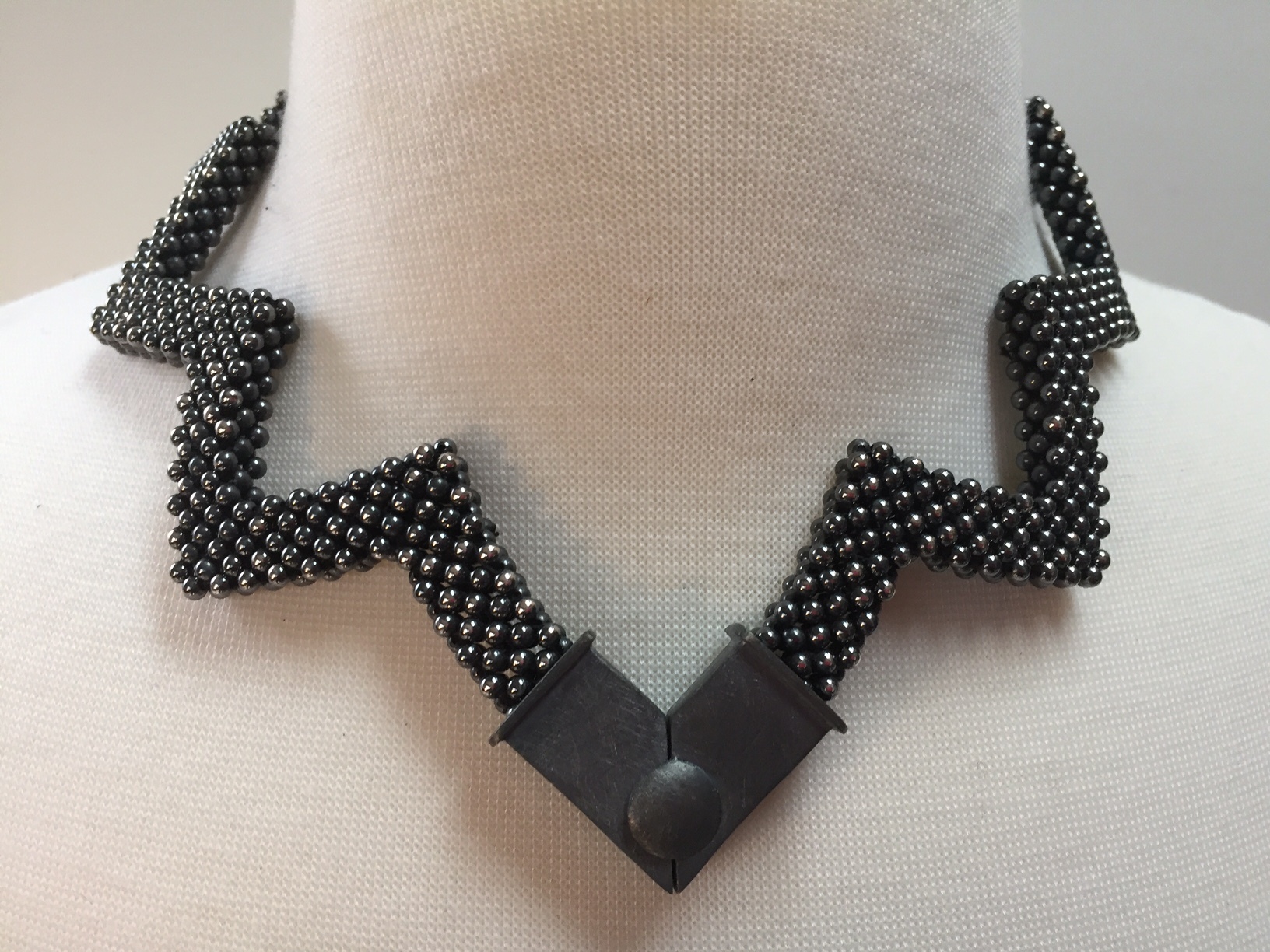 Reversible Sterling Silver "Lotus" Necklace with the clasp worn in front. This is the brighter side of the necklace.