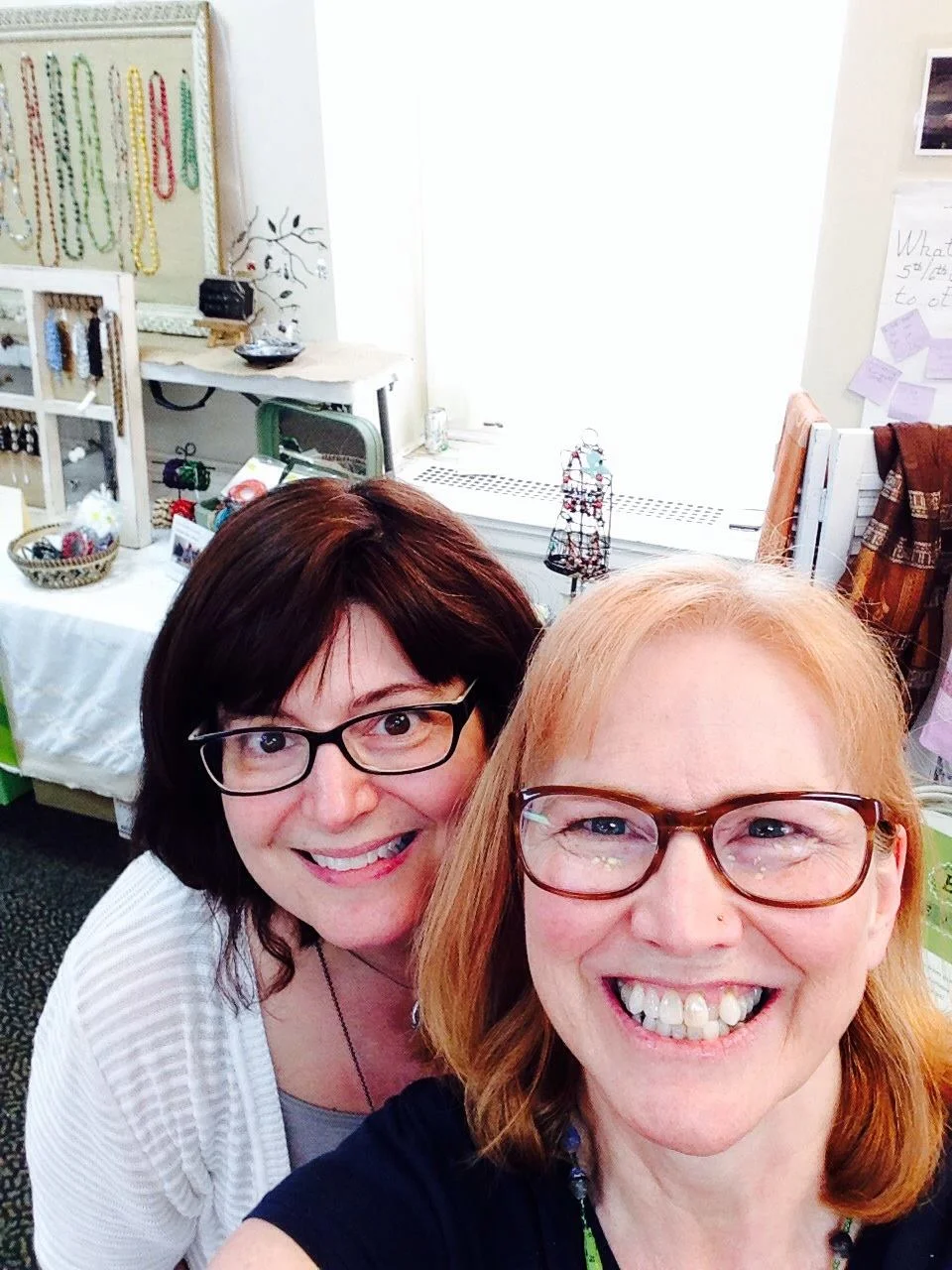 Julie and Deb selling Elevat products at a fair trade sale