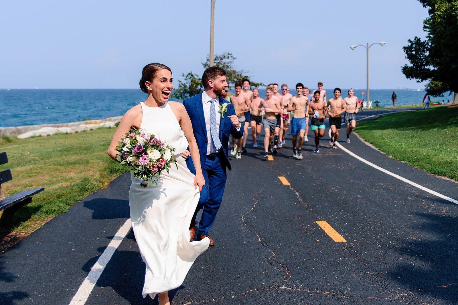  A couple runs along with some athletes running a marathon on their wedding day 