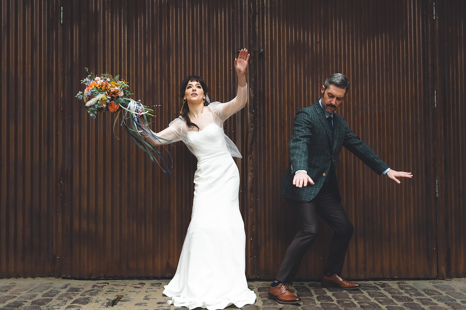  Quirky, Unique, offbeat wedding photography. Bride and Groom dancing like Netflix’s Wednesday 