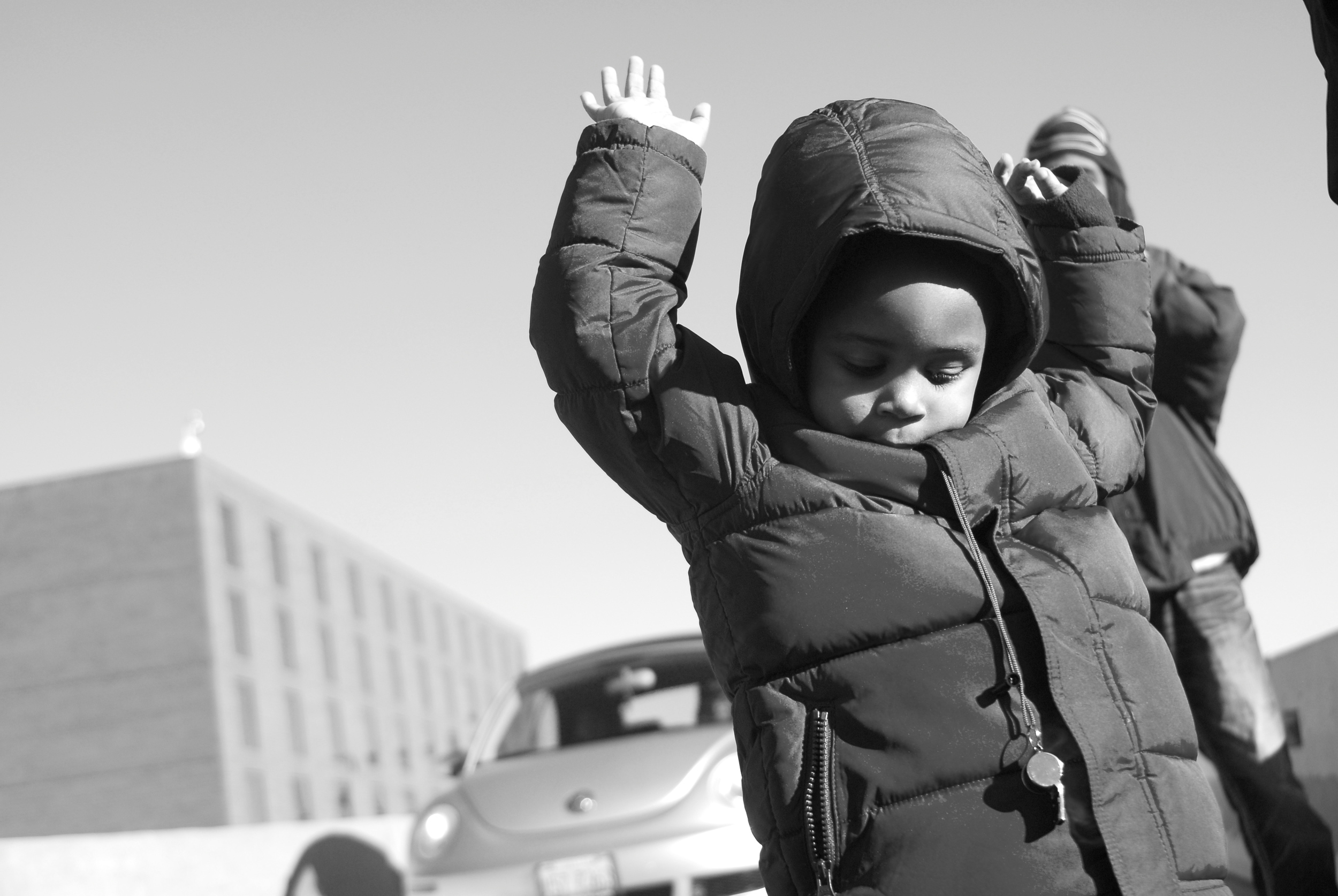  This little boy kept shouting, "Hands up! Don't shoot!" while marching alongside his mother. 