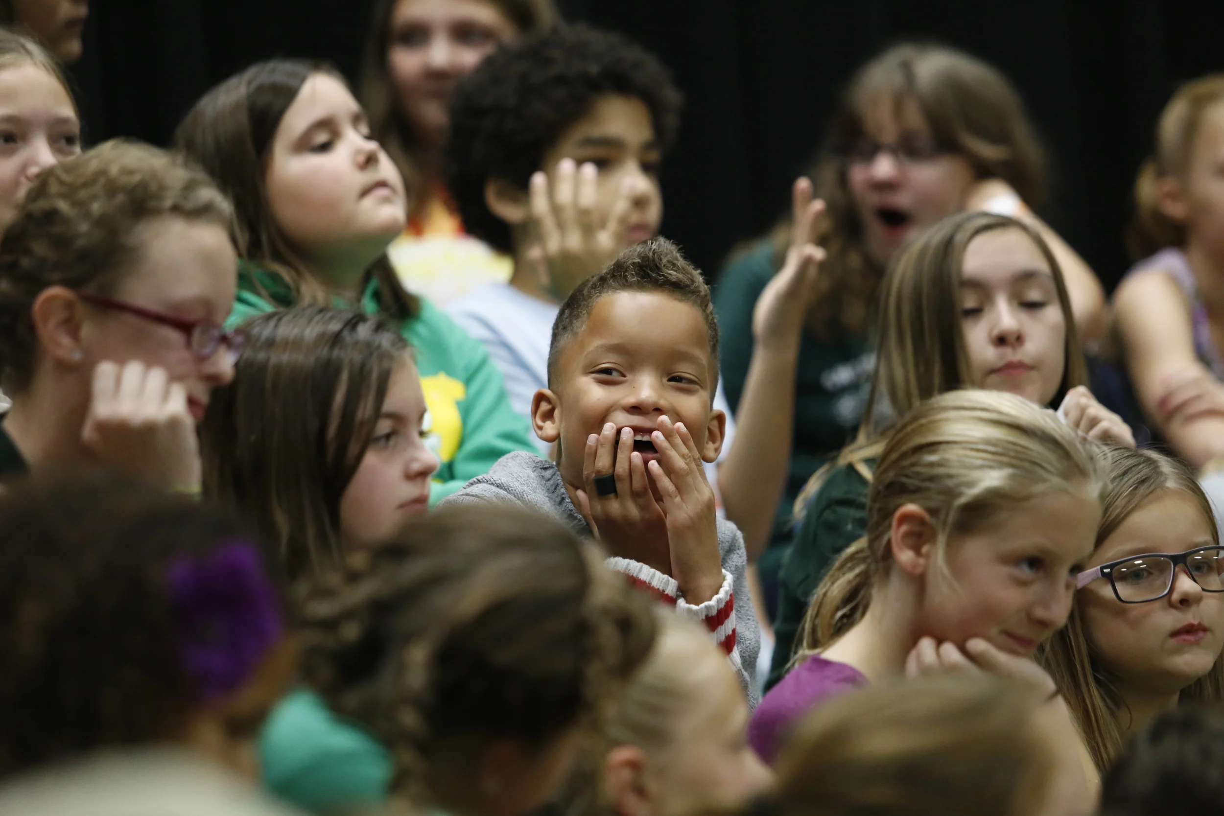  William Stanley giggles during a break in a choir performance during the Stanley Stampede, Saturday, Oct. 18, 2014. The performance kicked off the event. 