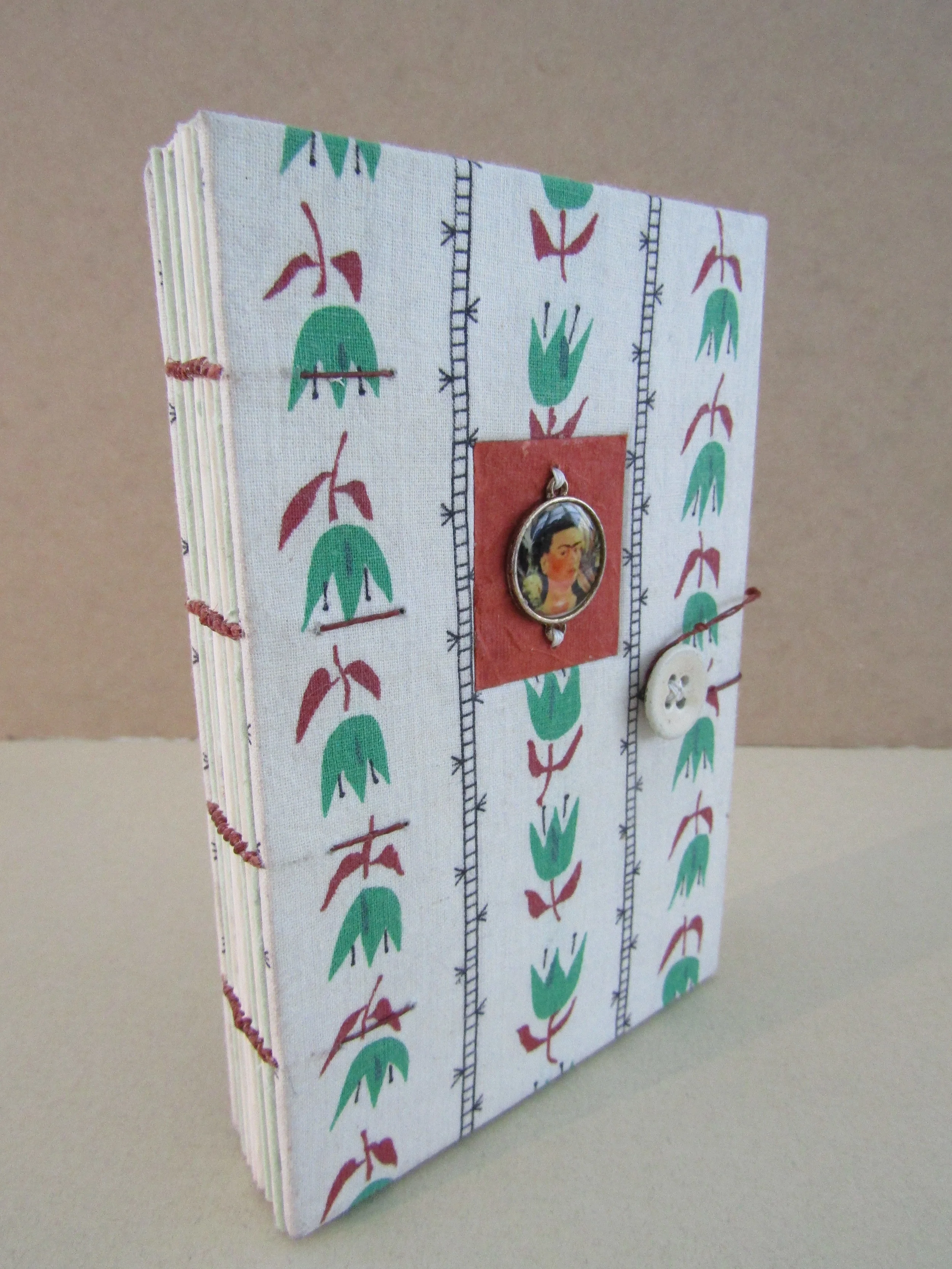 Four Needle Coptic Book With Backed Fabric and Sewn Embellishment on Covers