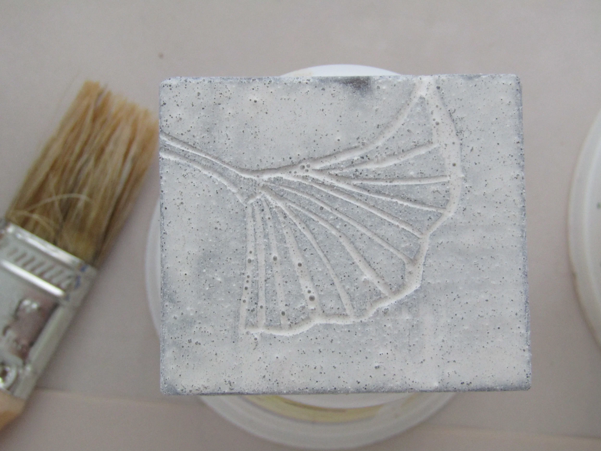 Painting multiple coats of milk paint; starting with white.