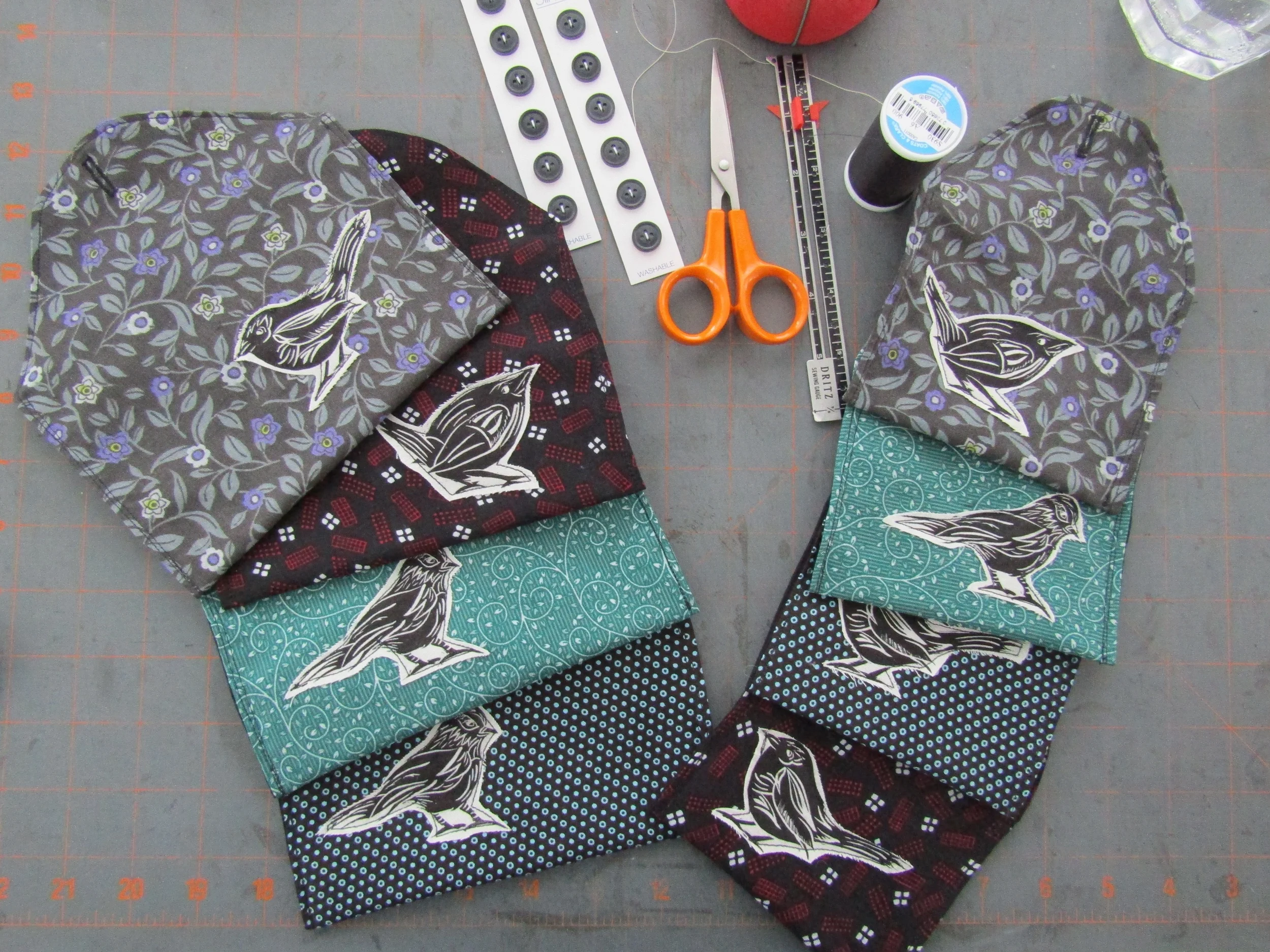 Purses are sewn up - adding the button closure.