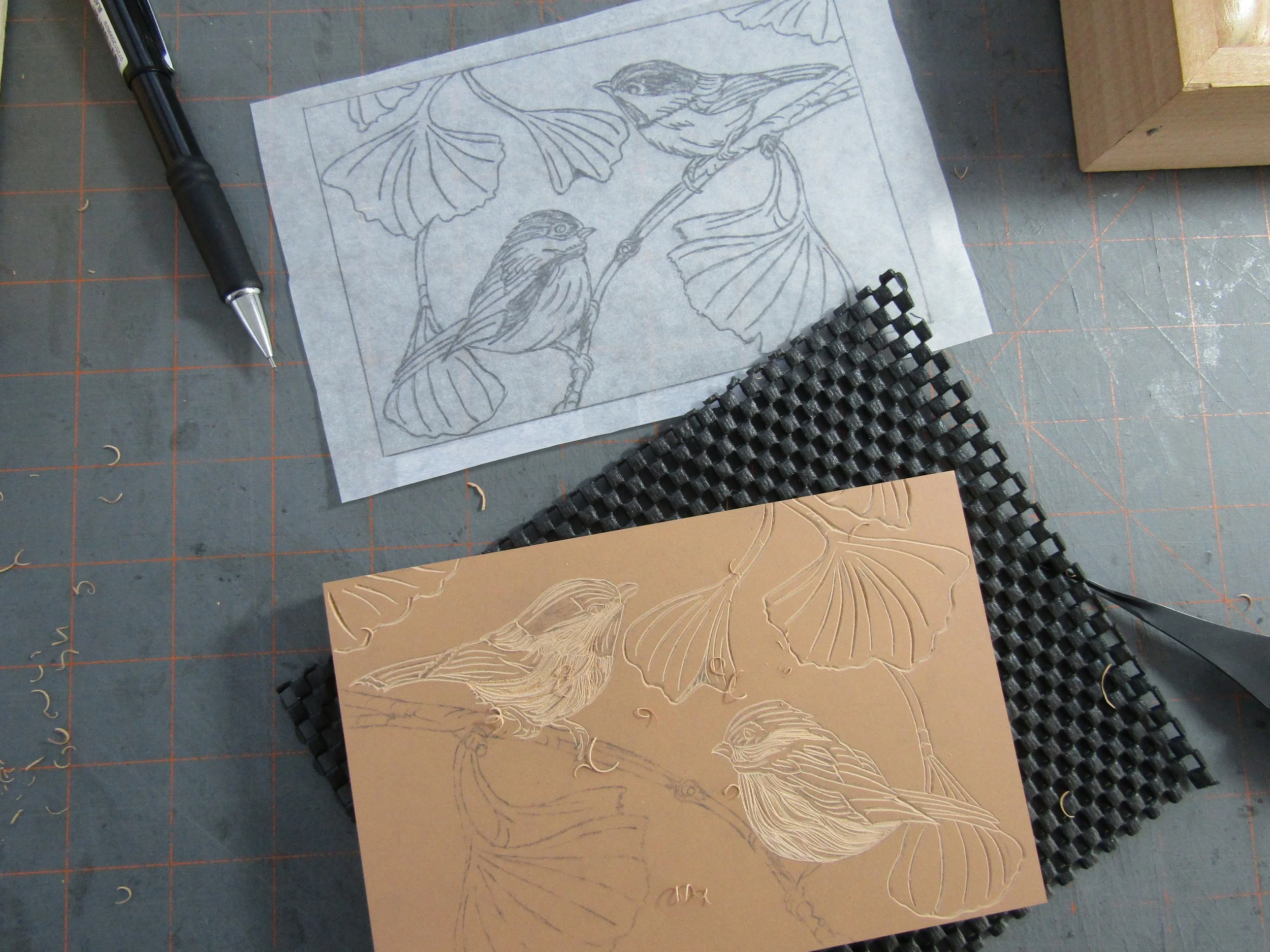 Carving a pair of chickadees perched in a Ginkgo tree.