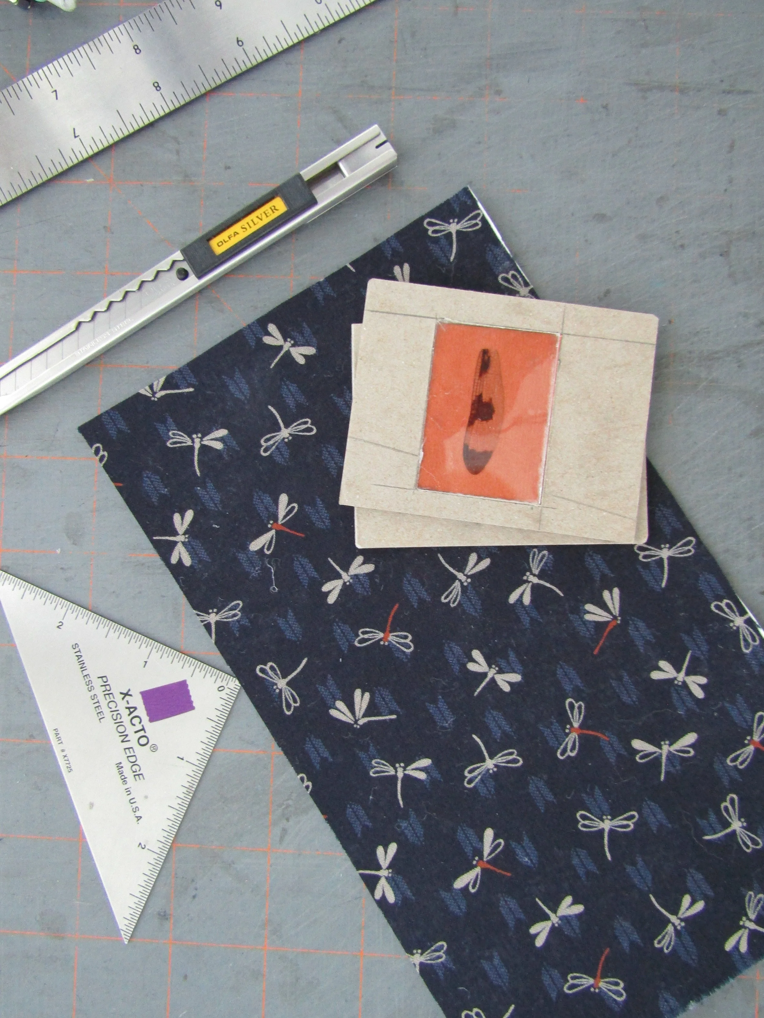 Working on a second cover using the blue dragonfly imagery.