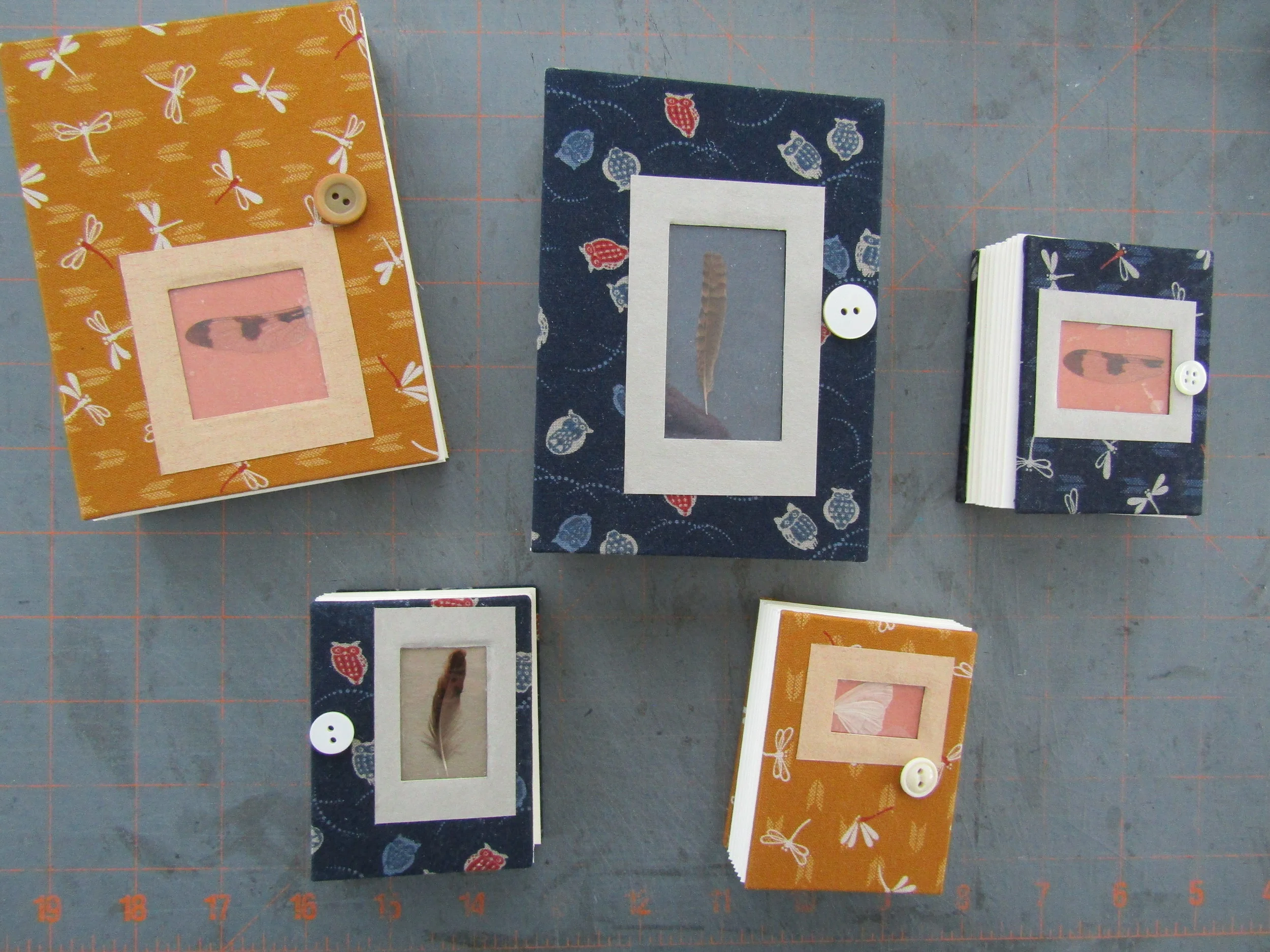 Multiple books of various sizes - text blocks cut and folded! I am now ready for sewing.
