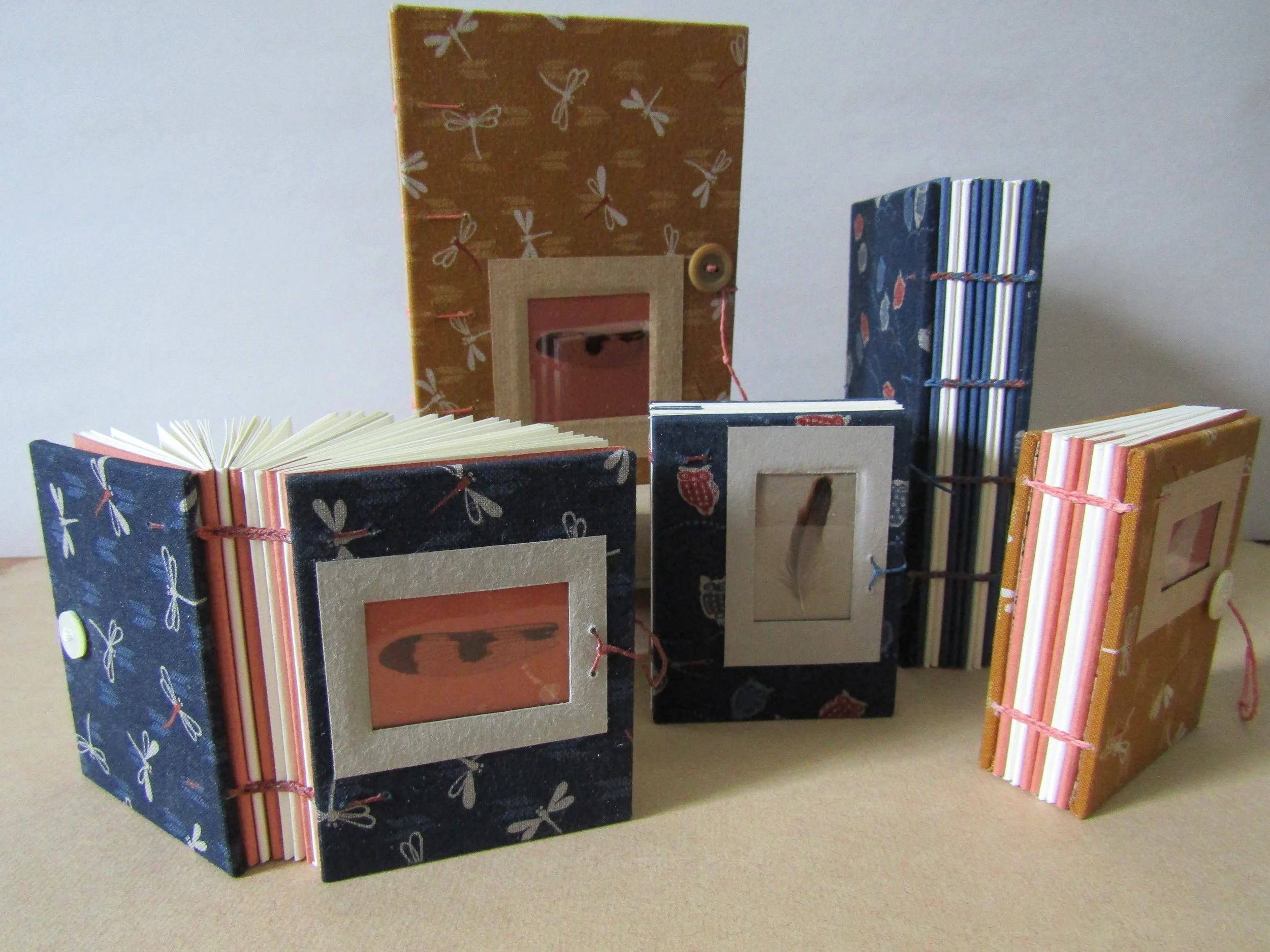 Completed books using vintage buttons and waxed linen thread for closures!