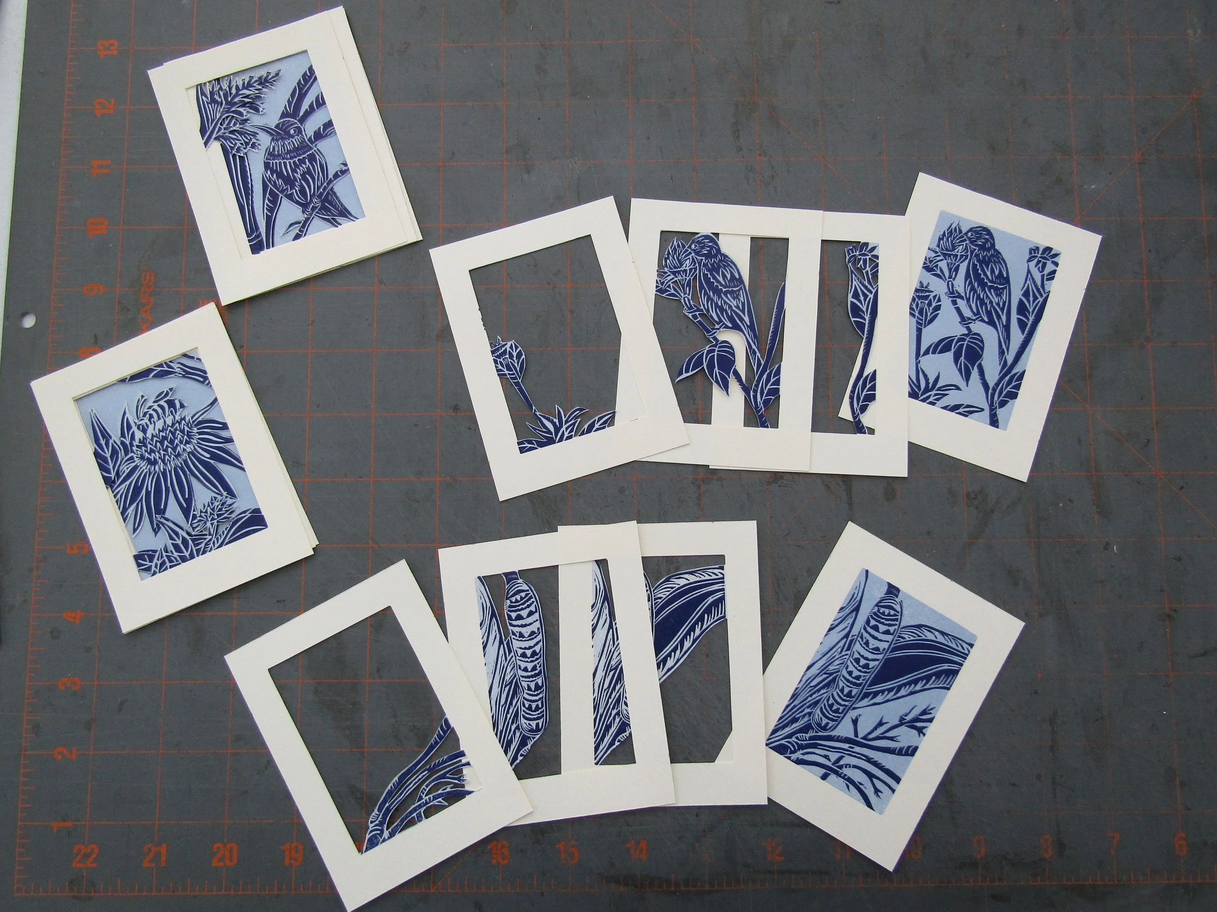 Cutting away spaces within the prints to create the pages for each book. 
