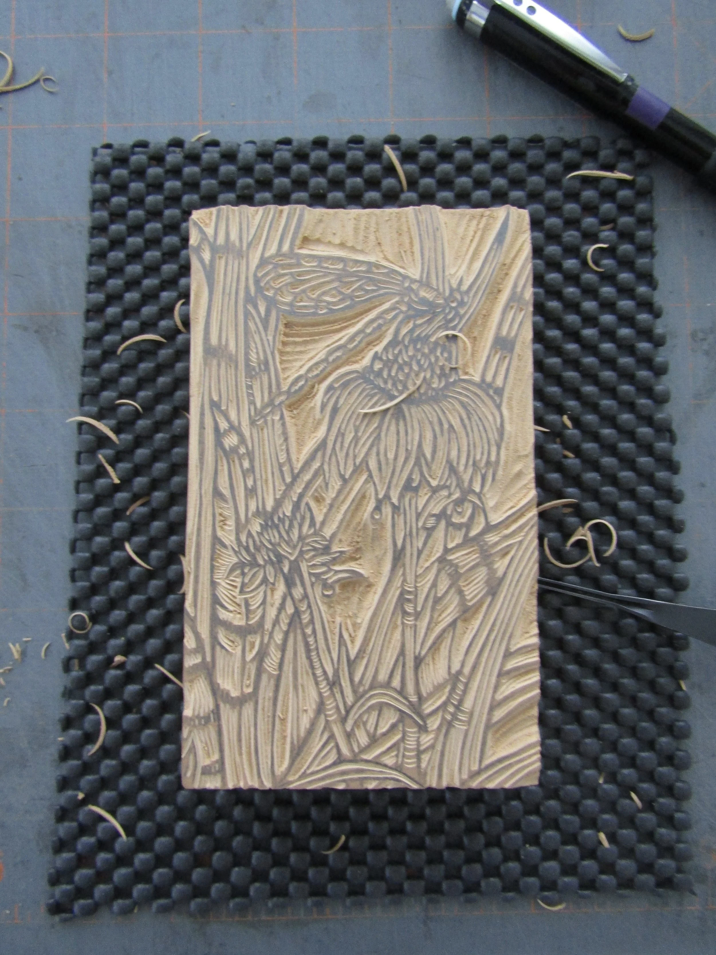 Carving the block.