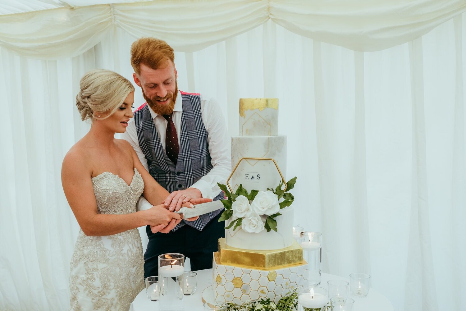 Modern geometric wedding cake with monogram and sugar flowers