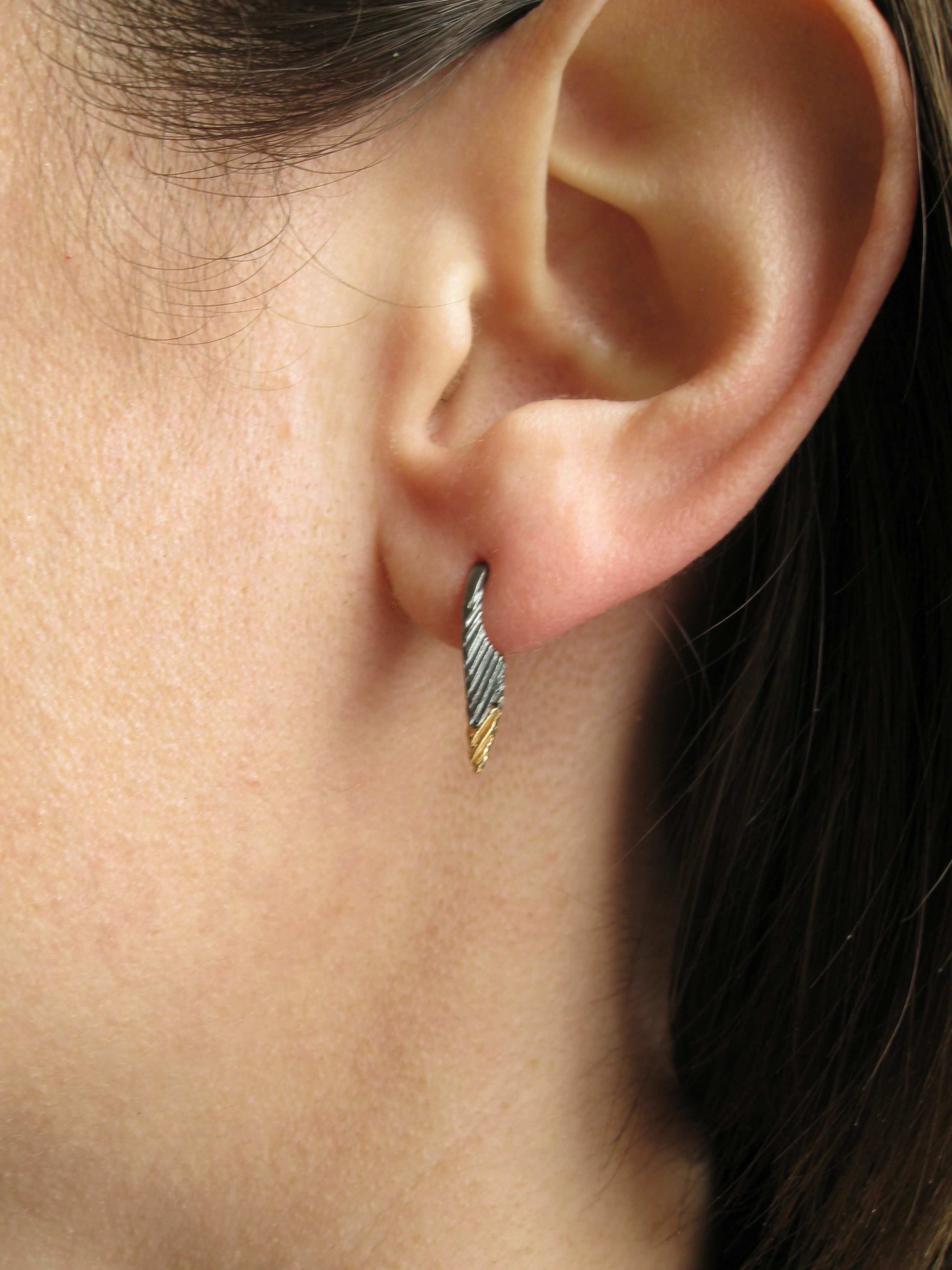 Short Spear huggie earrings in oxidized recycled sterling silver and recycled 14 karat gold