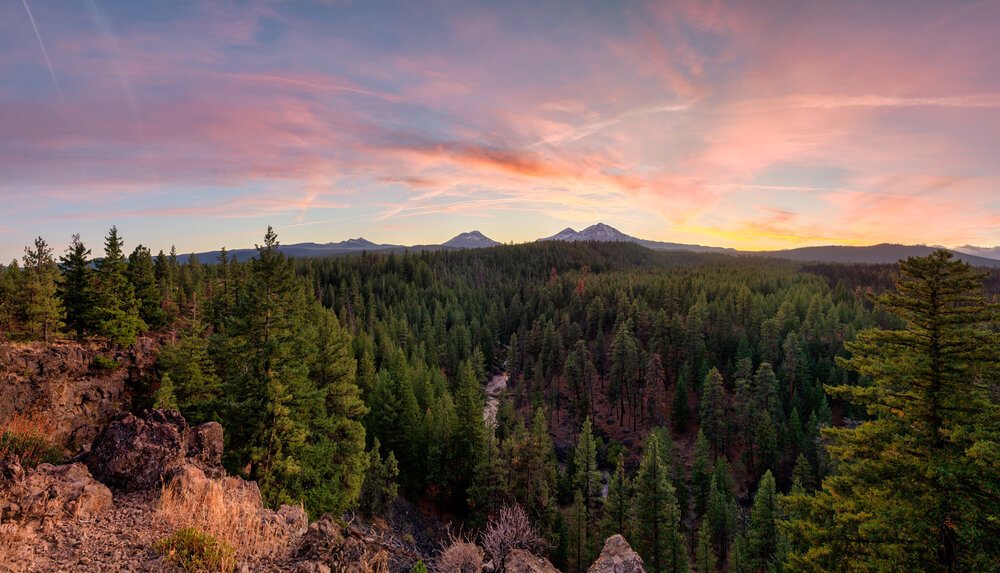 The Sun Sets Over Three Sisters Mountains In Bend Oregon