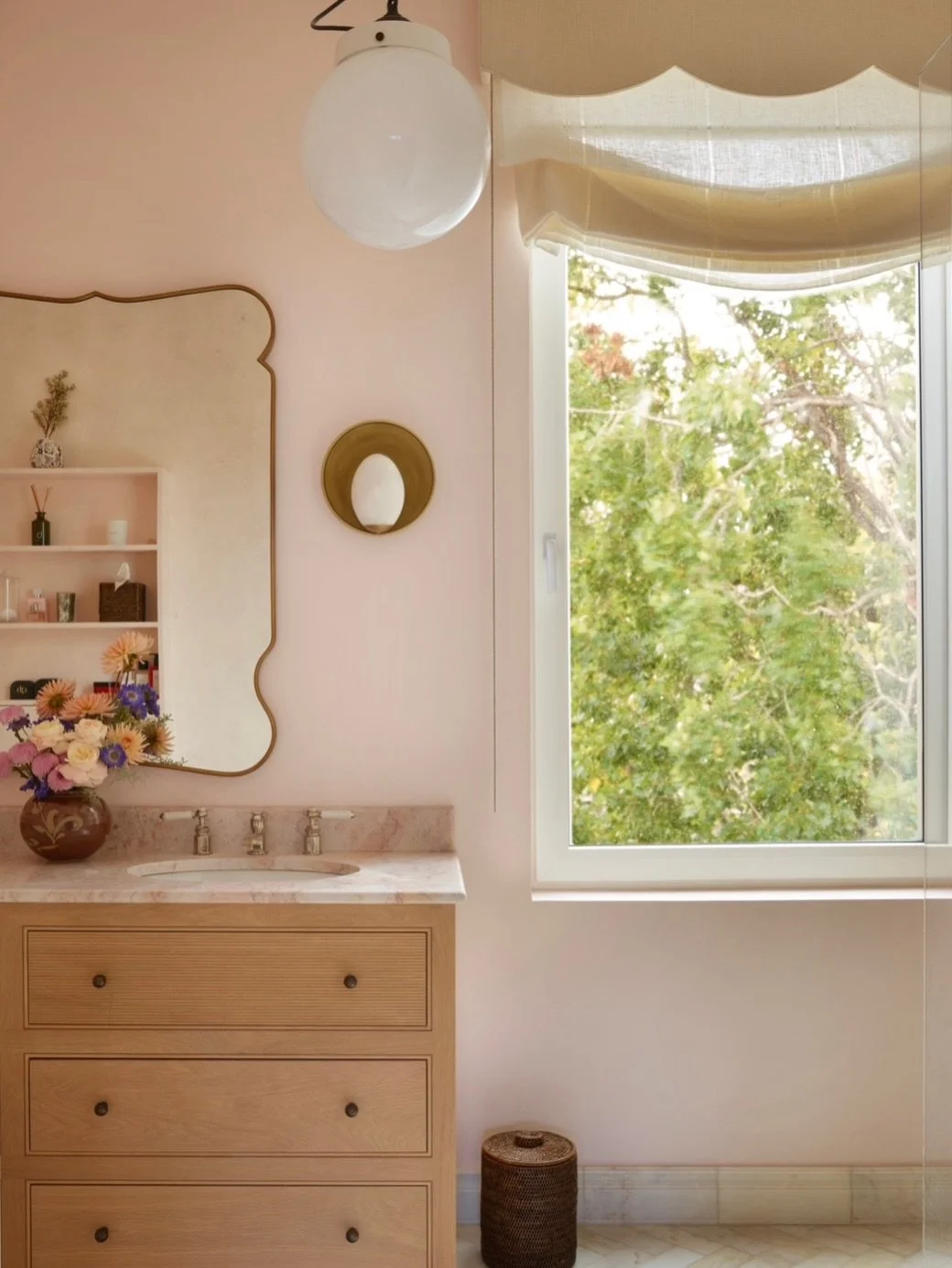An Ode to Atmosphere

For the Master Bathroom we paired alabaster scones with an opal glass pendant that hangs like a suspended pearl drop in a rose envelope. The subtly Venusian quality is heightened by scalloped detailing above the window reveal an