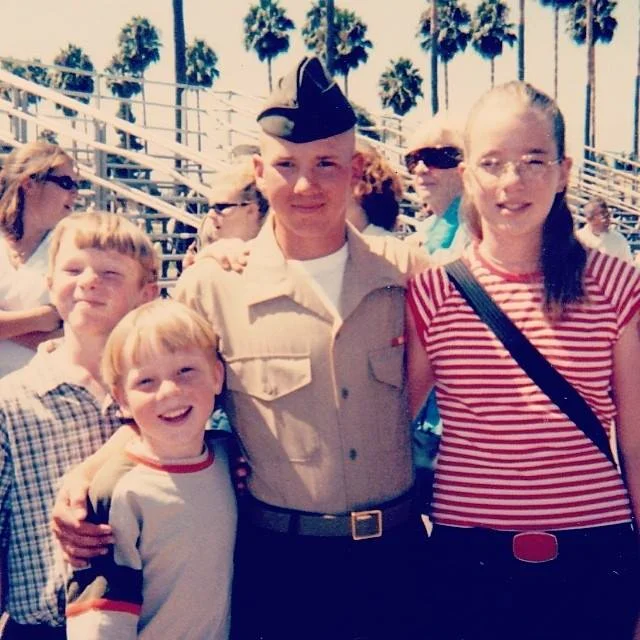 Jeremy graduates from Marine basic training, pictured with his sister and brothers.