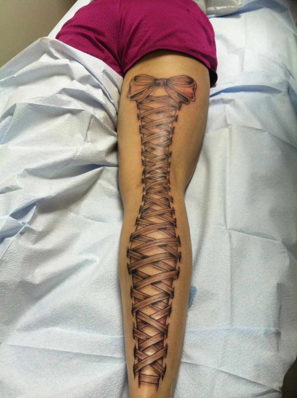 Corset Tattoo on Back Legs: Bold & Elegant