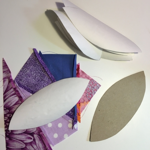 Seams pressed open, template fitting inside the fabric piece