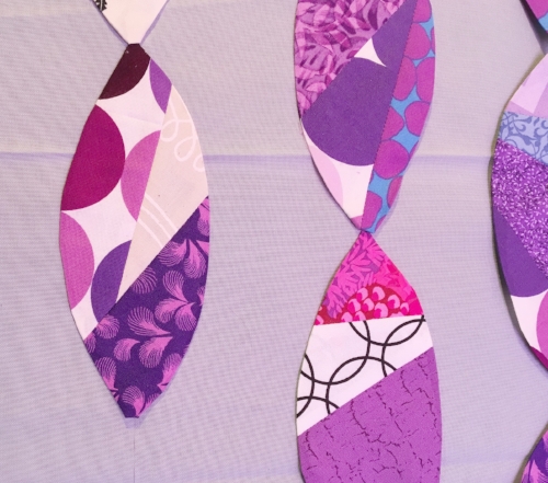 Appliqué shapes positioned end-to-end with no space between