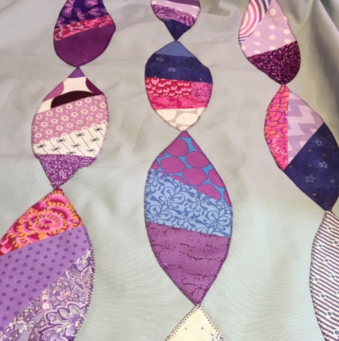 All appliqués secured with stitching