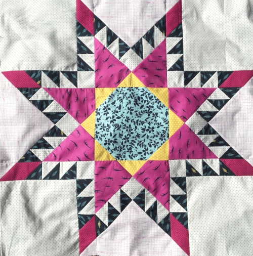 This 36" block also fell victim to my rotary cutter resulting in the lap quilt below! :)