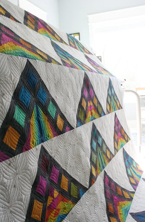 Maker: Brenda of Eye Candy Quilts Pattern: Nene by Eye Candy Quilts Pantograph: Starlight by Karlee Porter Designs Fabric: Quantum by Giucy Giuce for Andover