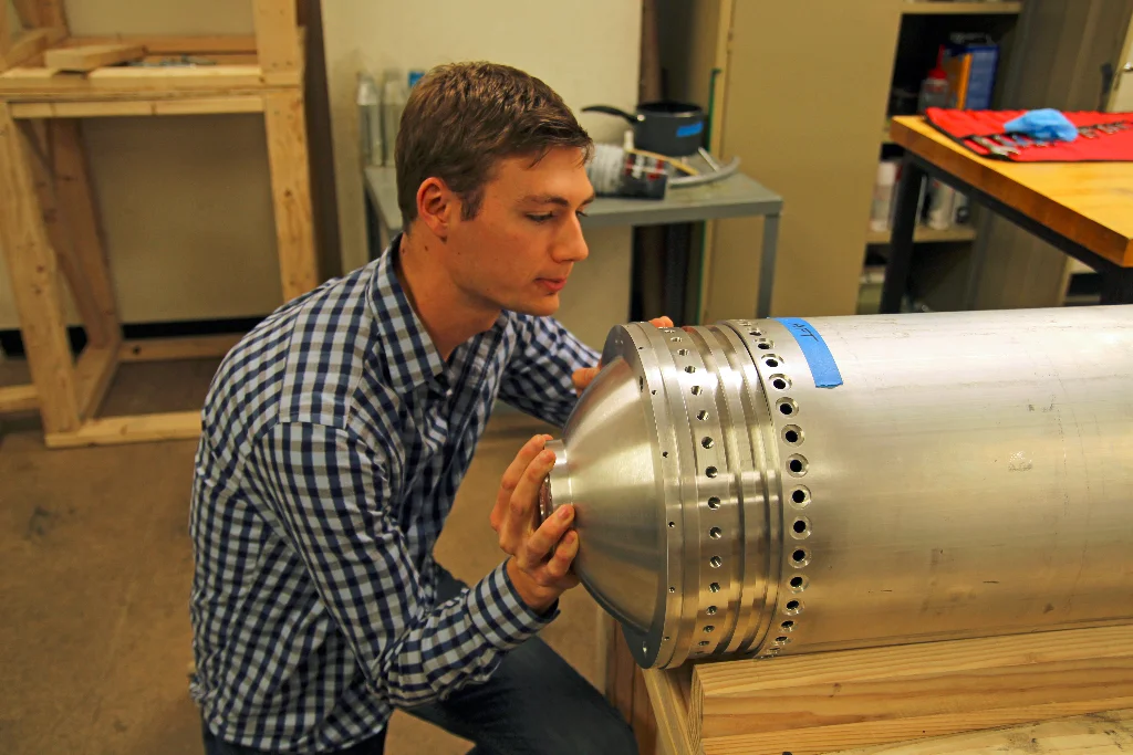 Armor Harris test fitting an oxidizer tank bulkhead onto the Starscraper rocket