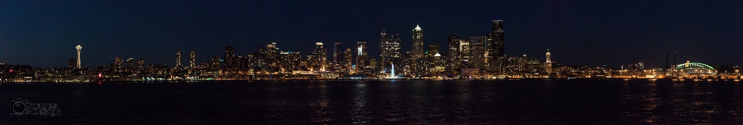 Night time Seattle cityscape as seen from Puget Sound. ©2017 Images by Design