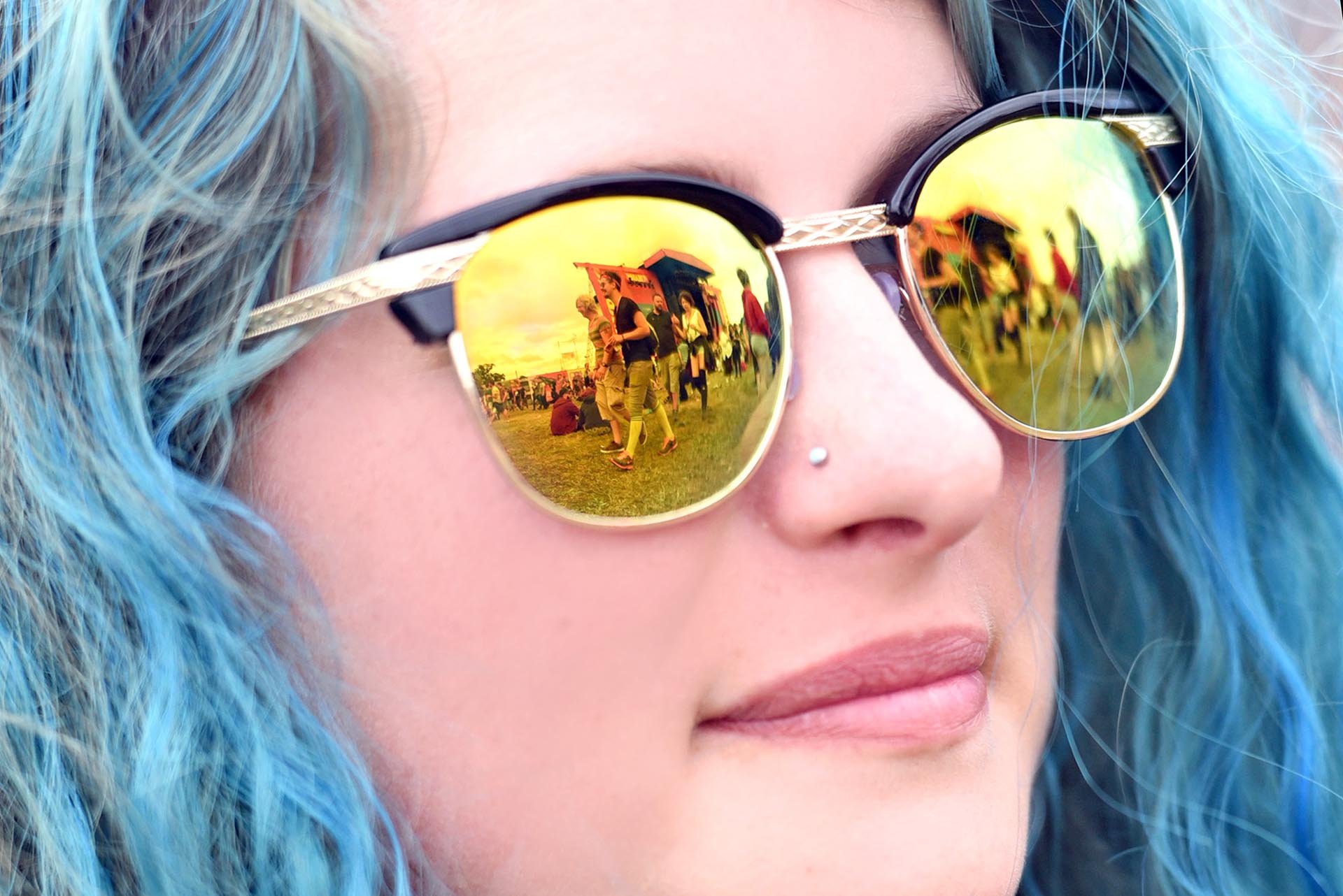 Reflection of Reading Festival in sunglasses.