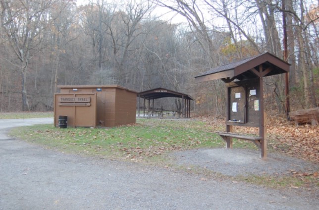 Rest room building, picnic shelter, and bulletin board at intersection of Tranquil, Falls Ravine, and Nine Mile Run Trails