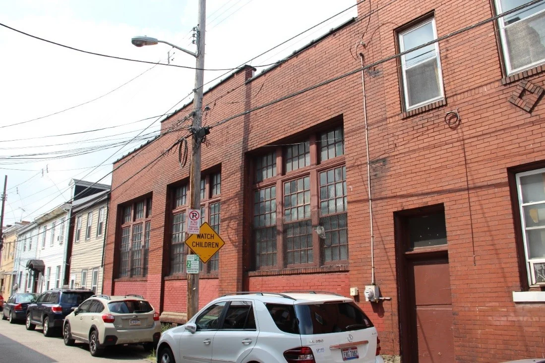 17 View northwest showing detail of gym section of community center and secondary entrance on Larkins Way.jpg