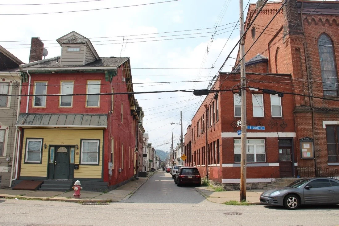 20 View west showing the community center addition in context on Larkins Way.jpg