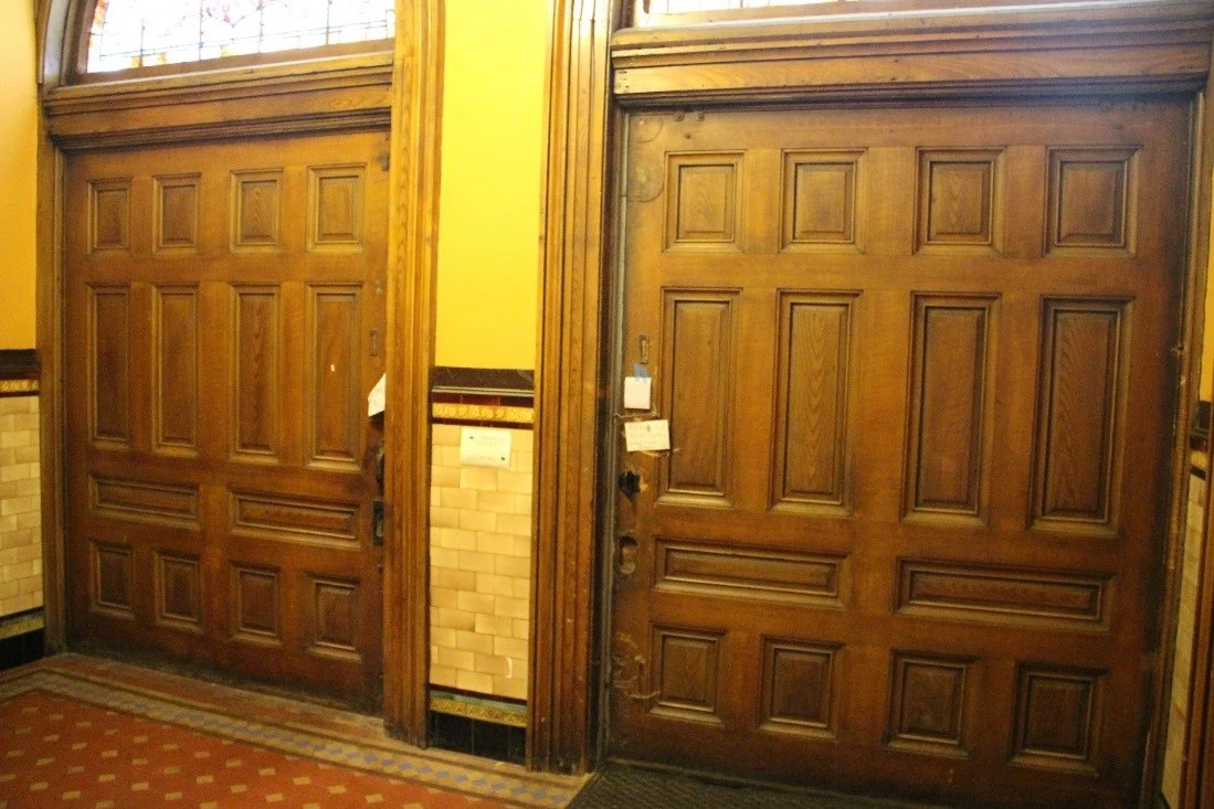 36 View north showing center section of 1st floor of narthex and the interior of the two pocket doors that face Sarah Street and serve as the primary entrance.jpg