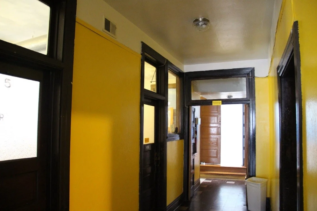 63 View west showing main 1st floor hallway of the 1913 community center.jpg
