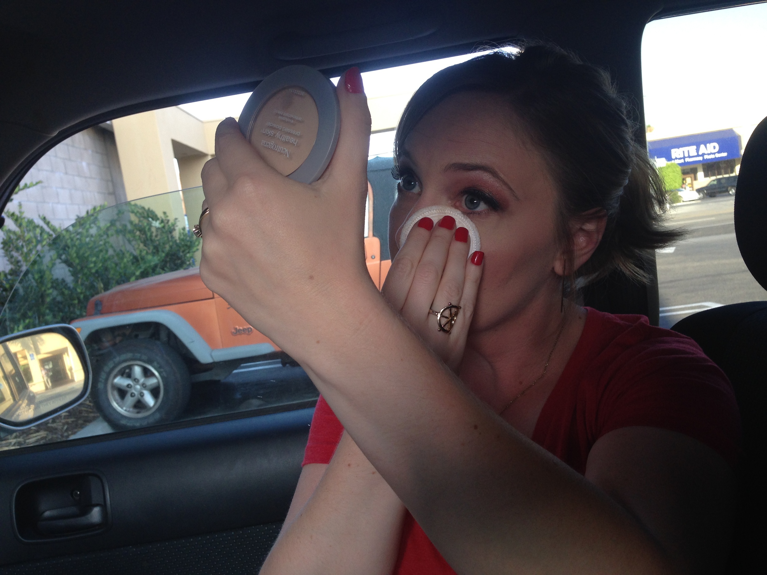 Erin getting ready in style, in the McDonald's parking lot.