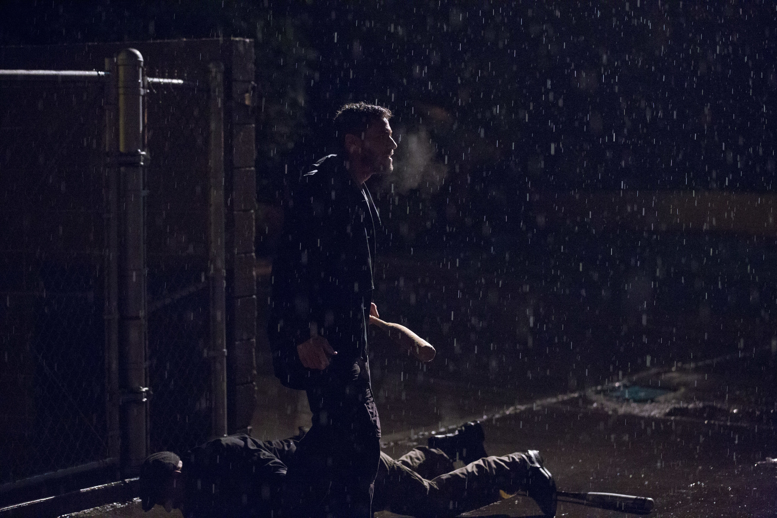 Brandon Quinn (Slugger) standing over Carlos Ragas (Thug 2) on a rainy, rainy night. Photo by PJ Barlow.