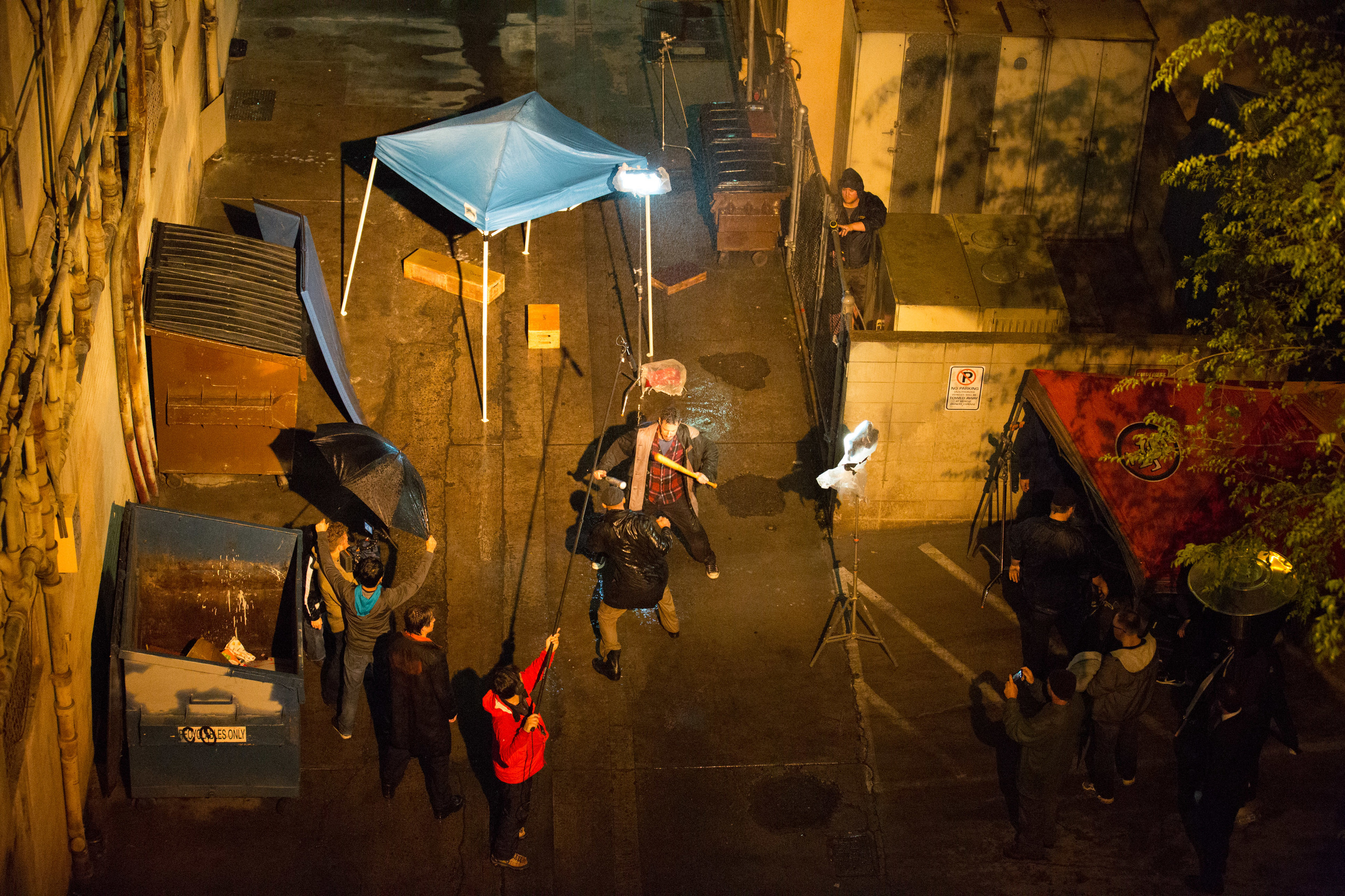 Bird's eye view of staging the fight scene. For a long while, we had a crowd of pot-smoking soccer players gathered above us on the parking garage, watching it all go down. Photo by PJ Barlow.