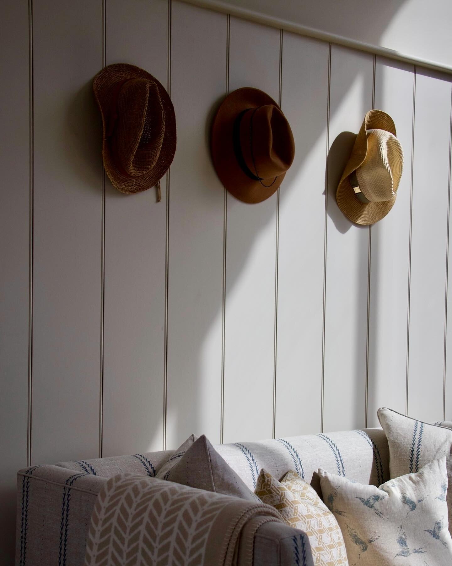 A quiet entrance. 

Layering printed linens in muted tones. 

Curtains: Sea Tangle Chateau Blue. 
Sofa: Upholstered in Feather Blade Atlantic
Cushions: Palma Sol Antique Ochre, Bollin Bird Dew on Natural, Malla Antique Ochre. 
Re-cycled Cotton Throw 