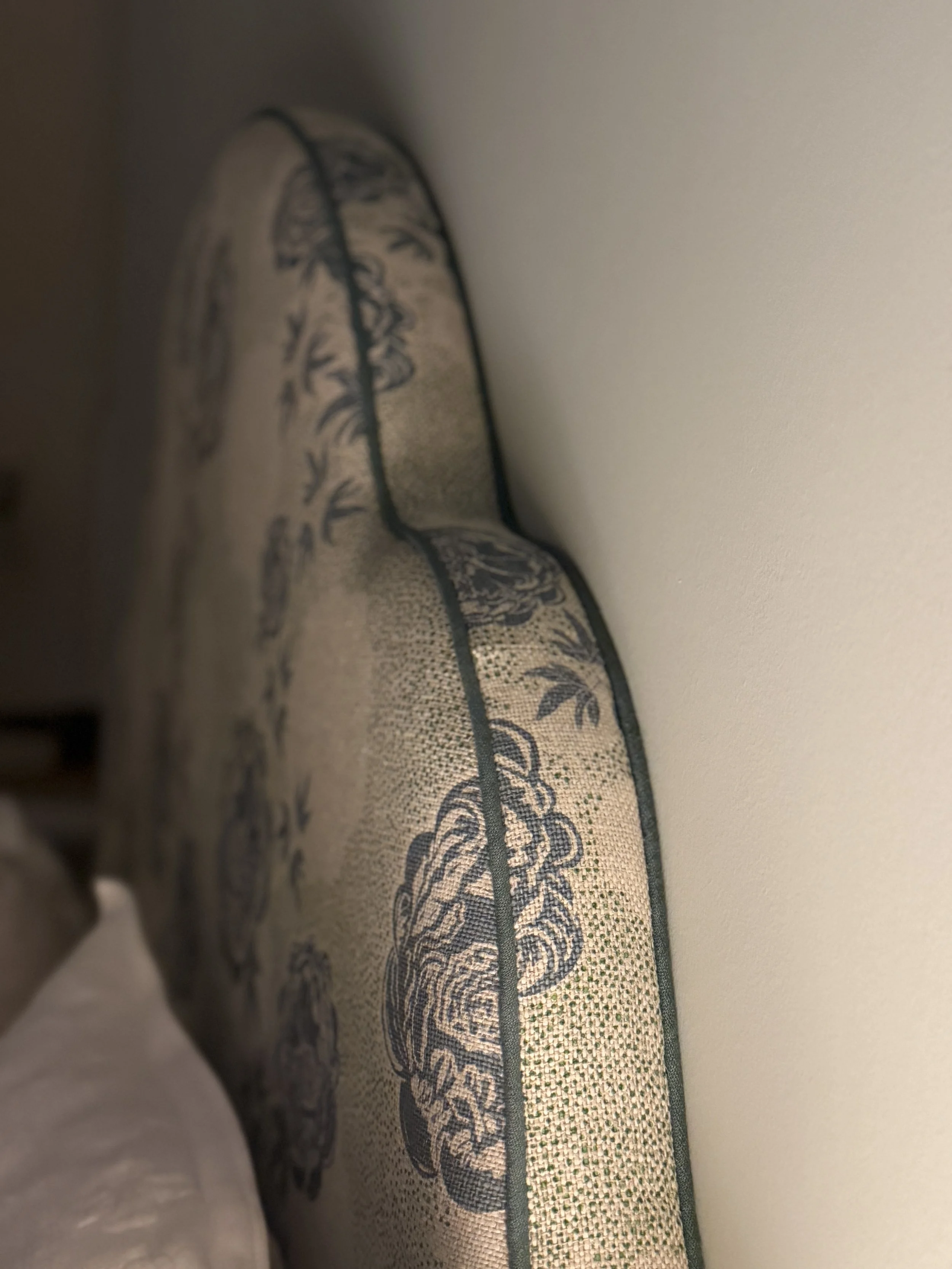 Headboard side shot of Peony Echo Lakes and Samphire printed linen