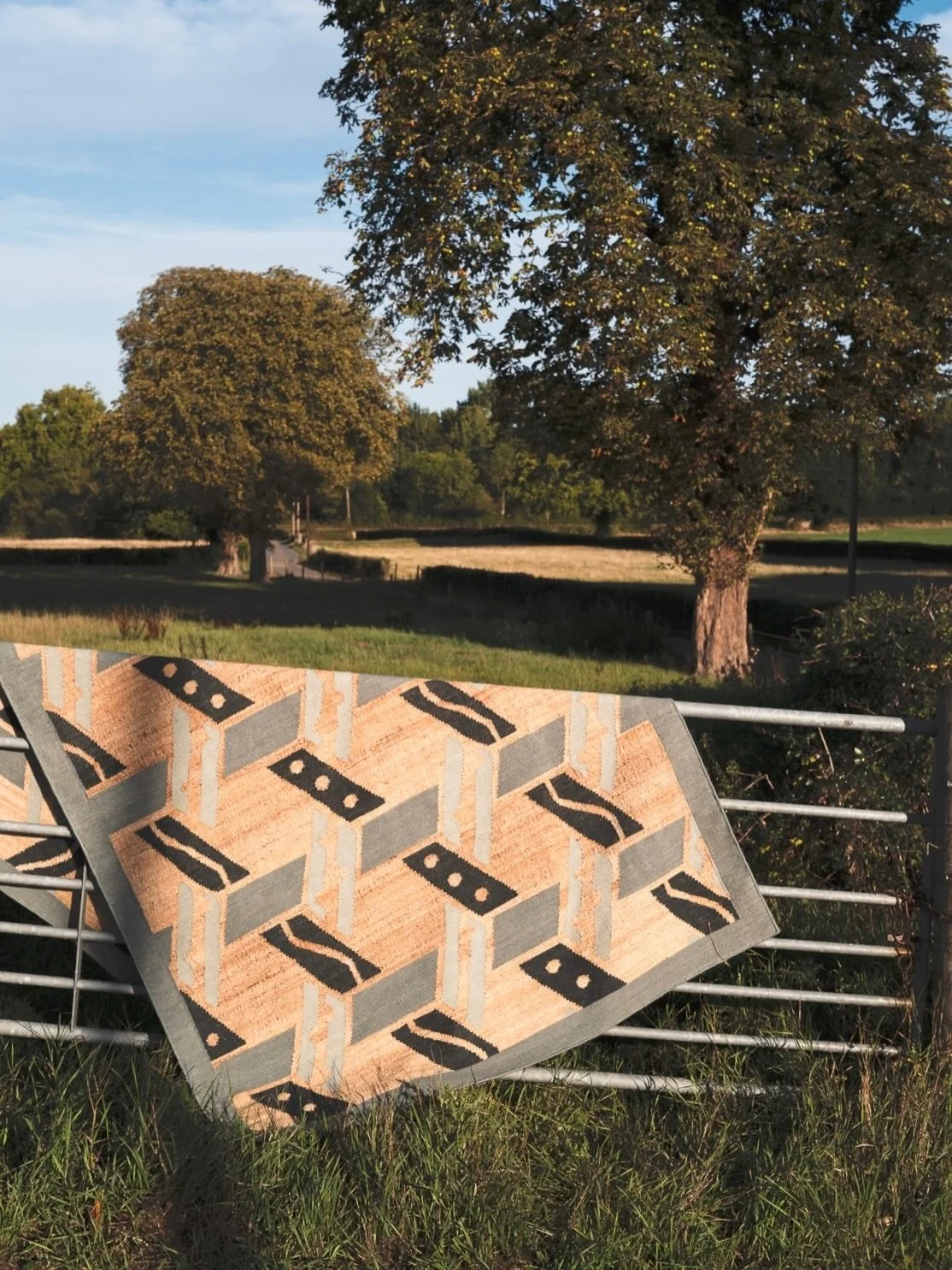In summer last year photographer @nick.compton took the Malla rug from our collaboration with @coralandhive 
into the countryside for a little photoshoot.  We love how the geometric hand woven pattern and blue and sisal yarn colours contrast with the