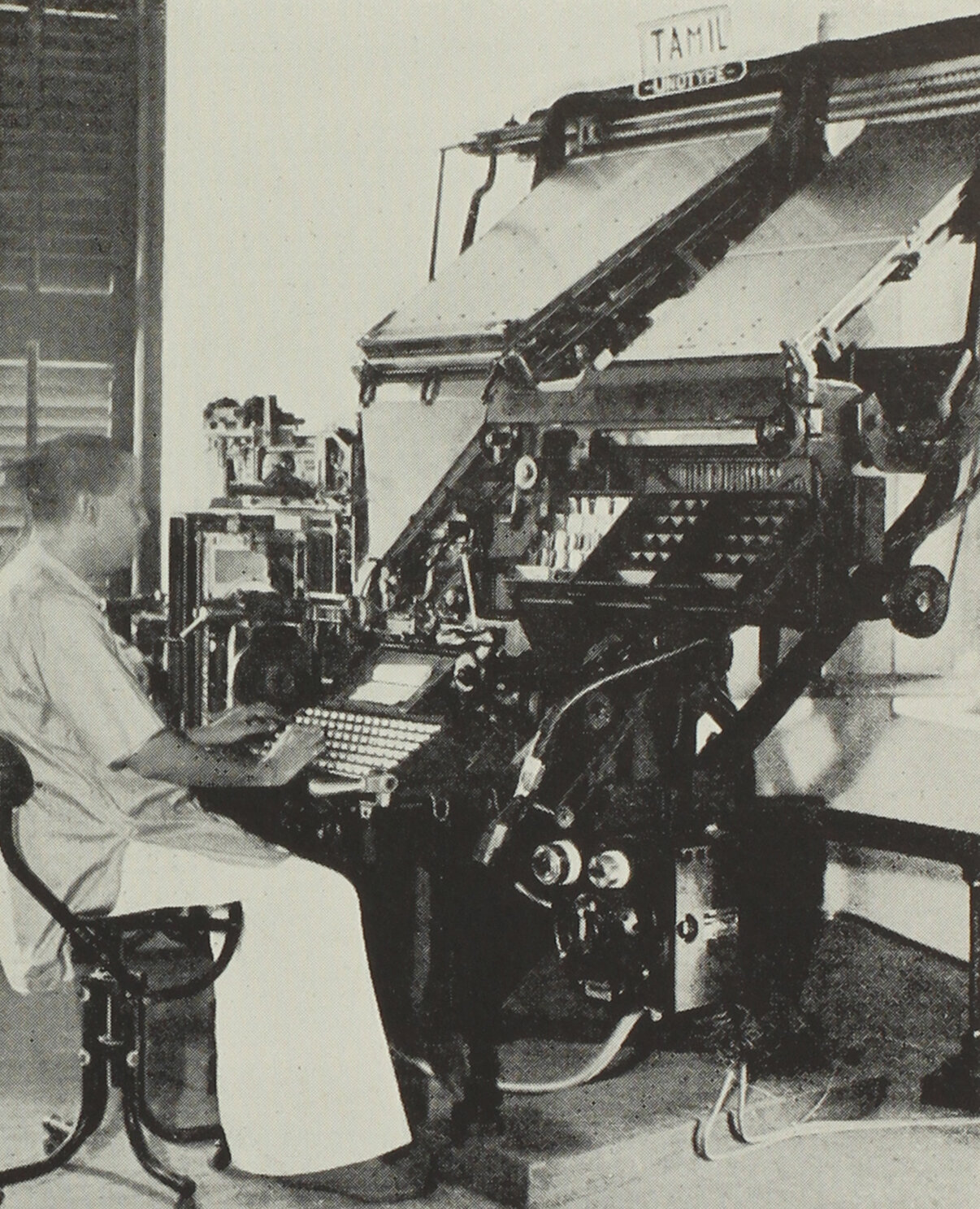 △ The first Tamil Linotype machine erected and running at the Linotype Company’s Madras office, 1936. The machine was equipped for English and Tamil typesetting from the same keyboard.