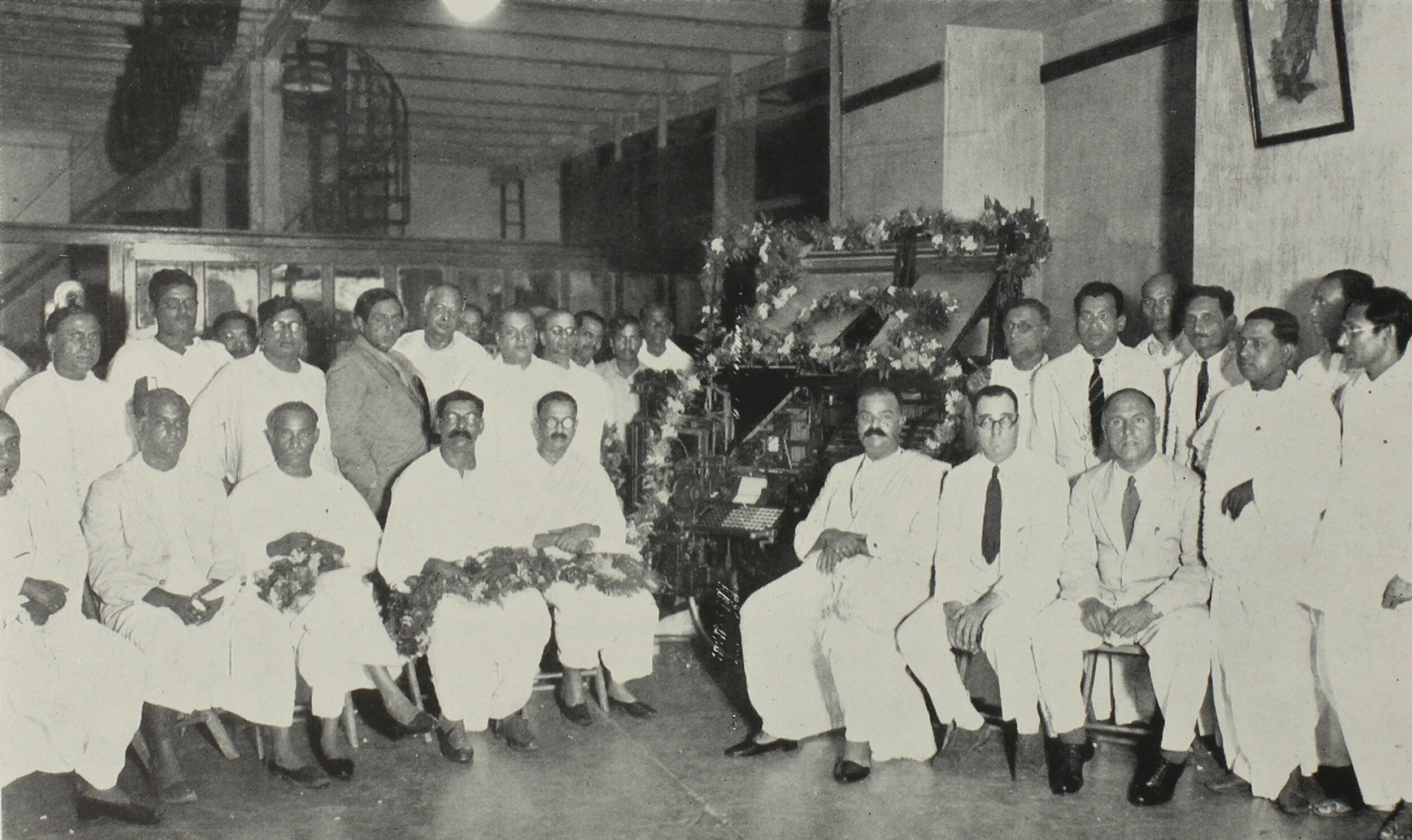 △ The inauguration of the Bengali Linotype, Calcutta, 1936. Seated on the right: Shyama Prasad Mukherjee, Vice-Chancellor of Calcutta University; A.J. May, Manager of L&M in India; Tom King, Assistant Manager of L&M India. Hari Govil can be