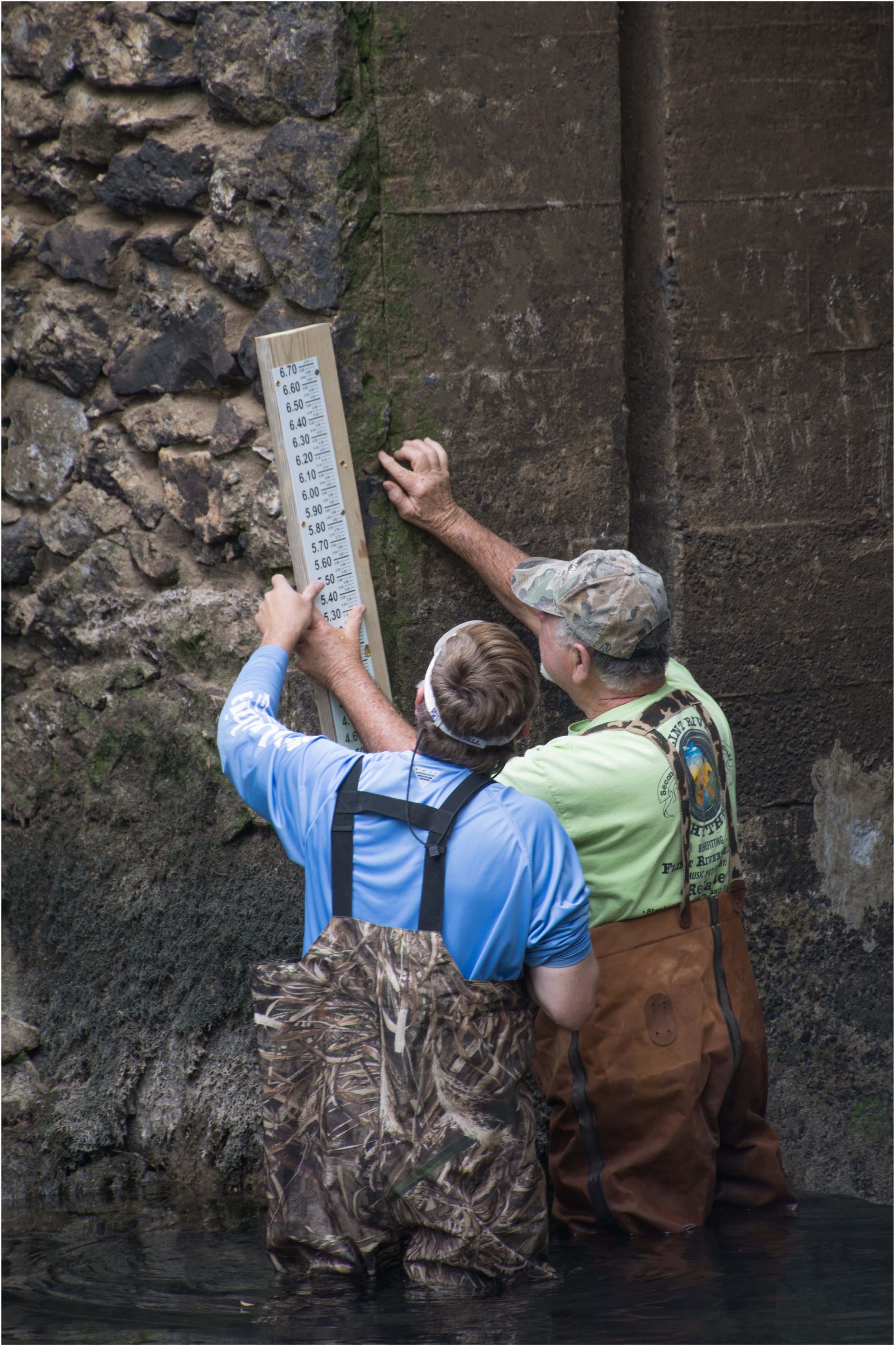 Measure spring output and monitor groundwater within the spring shed