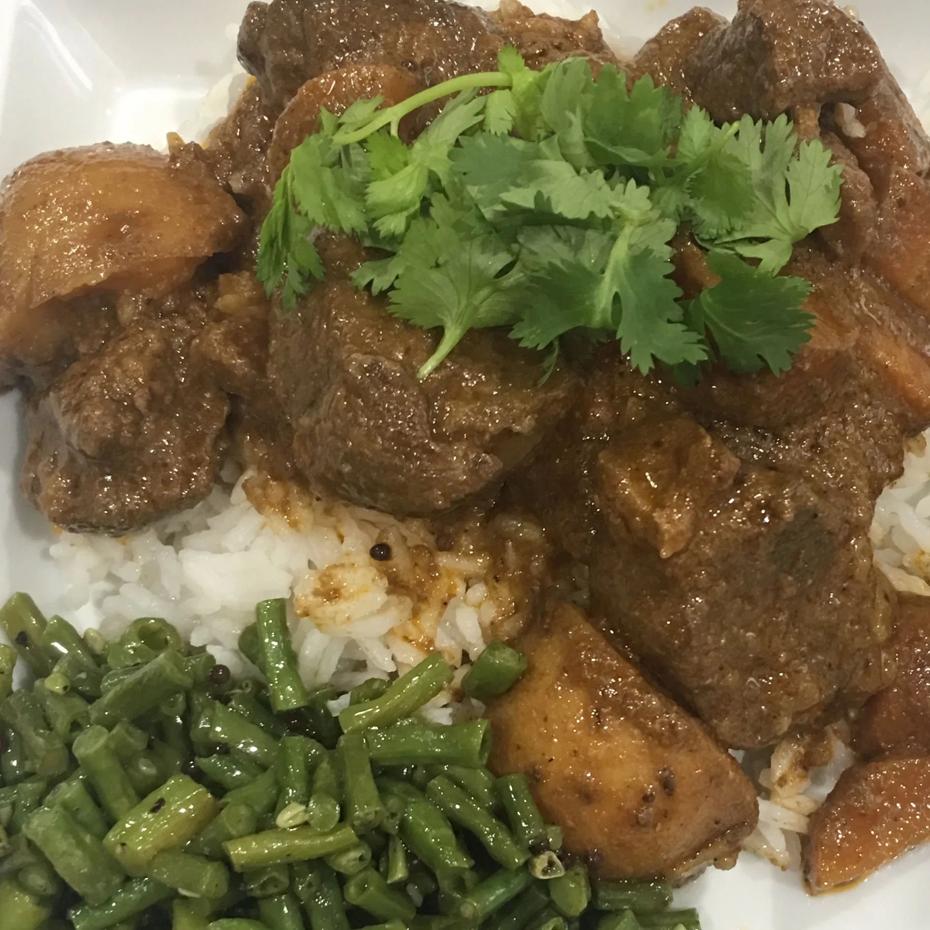 Shown her over basmati rice and Asian Long Beans with Mustard (in recipes)