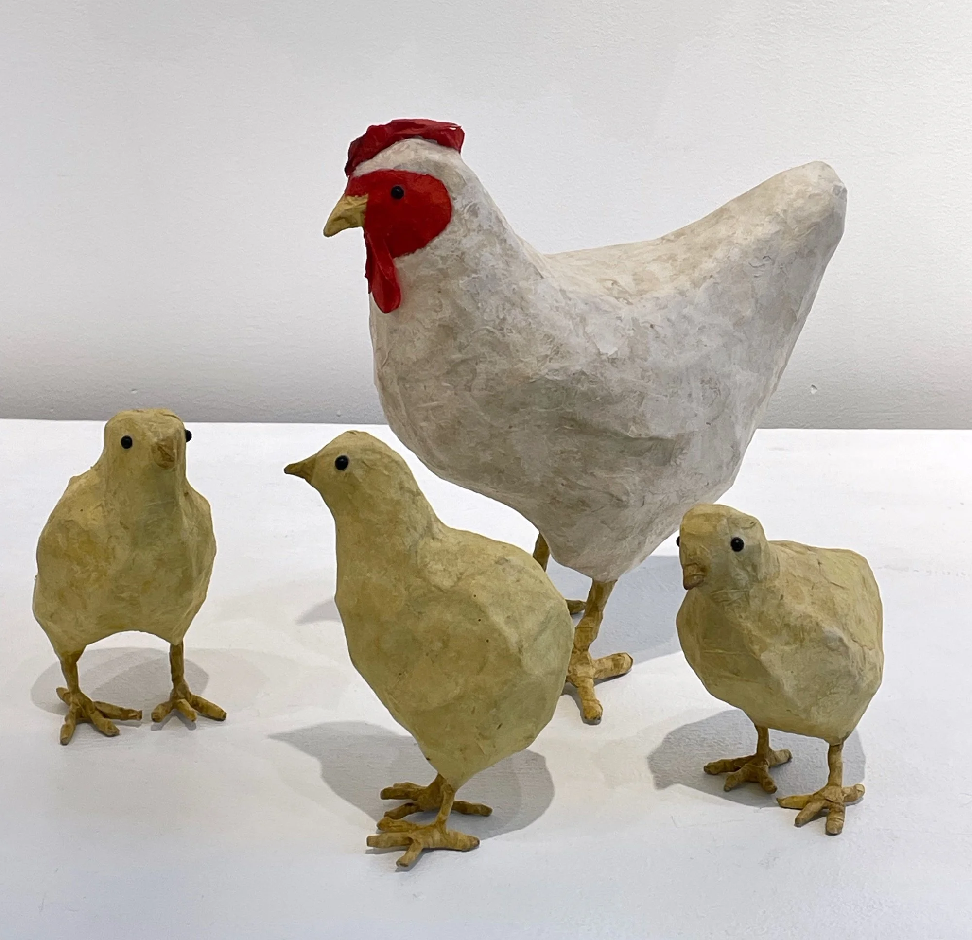 3 chicks white hen 2.jpeg