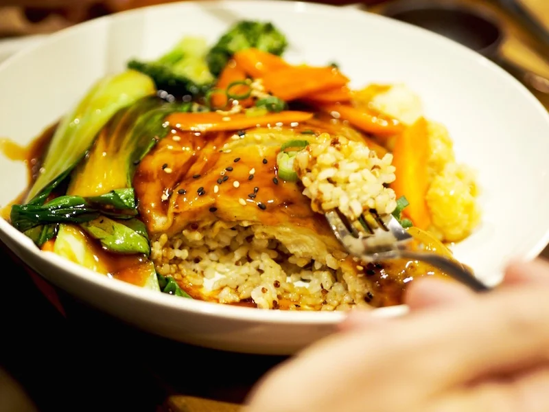 Teriyaki Wheat Chicken, served with biodynamic brown rice, steamed vegetables and house-made pickles.