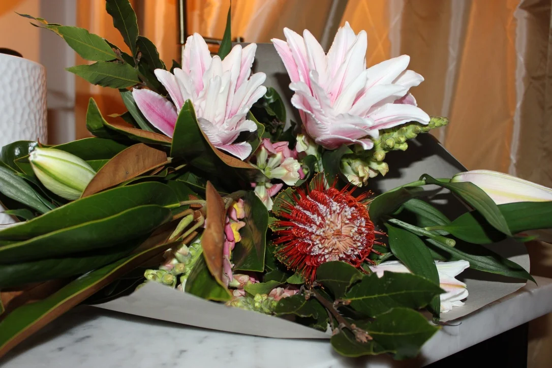 Choosing locally grown flowers at the florist.