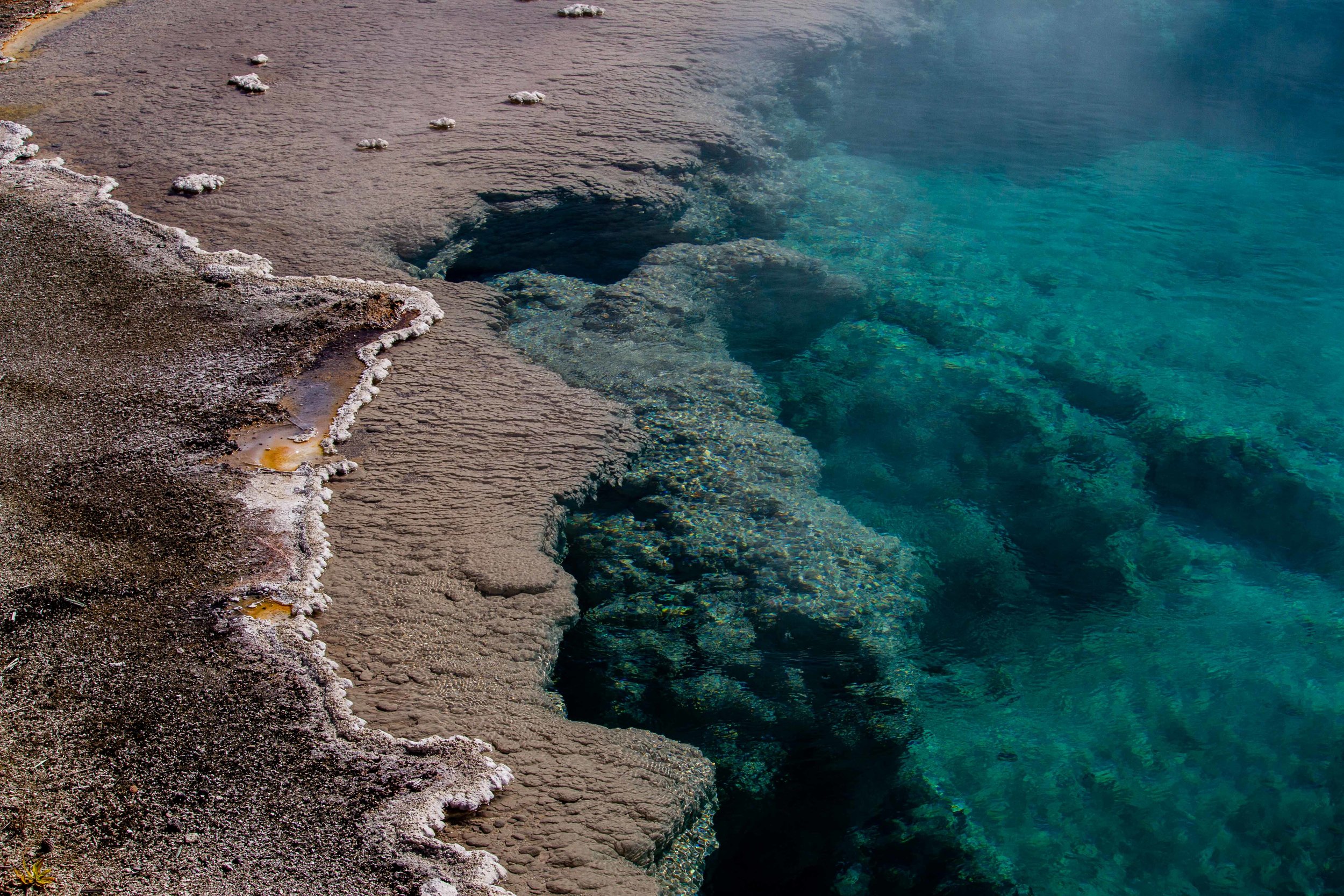  Colors in hot springs are caused by thermophiles; different creatures can tolerate different temperatures, creating color gradients. 