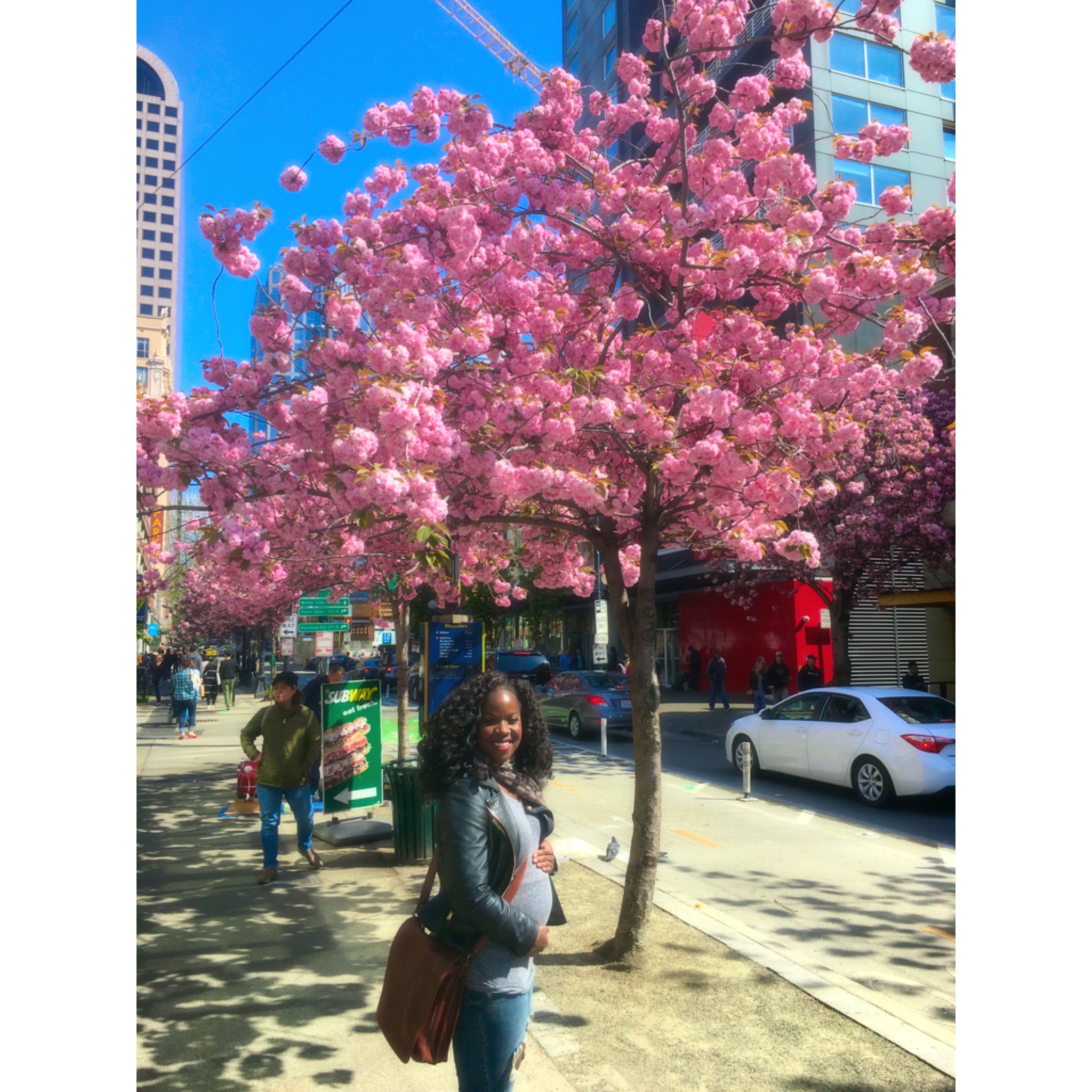 Showing off my baby bump on my birthday across from Pike Place!