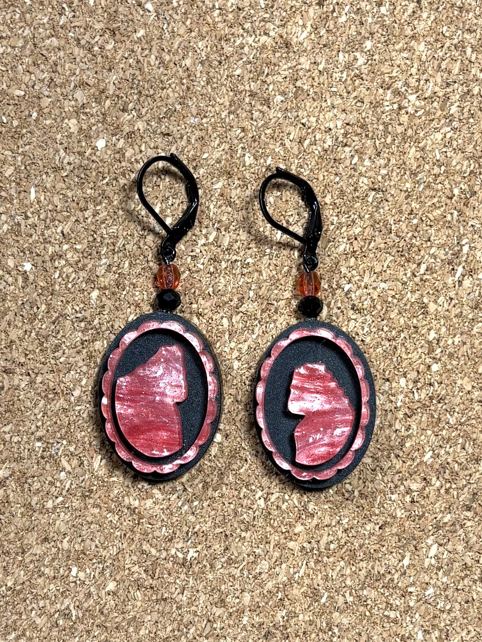 Cameo Squatch Earrings Pink on Black close up.jpg